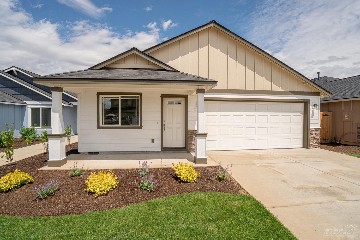 Just completed & move in ready! Situated in one of NW Redmond's premier neighborhoods w/a view of the Cascades. 3 bedroom, 2 bath, 1,745 sf of open living space. Entertaining is easy w/ this huge great room w/durable Laminate flooring, crisp white trim package & a cozy fireplace. The Kitchen extends to Dining w/breakfast bar. Upgraded finishes include Quartz slab counter tops, all Stainless Energy Star appliances & spacious pantry. Master Suite features a vaulted Tray style ceiling, bath with walk in shower, dbl sinks & tons of storage. Gas forced air high efficiency furnace & A/C installed. Double car garage, front & back yard landscaping w/ auto sprinklers, fully fenced.