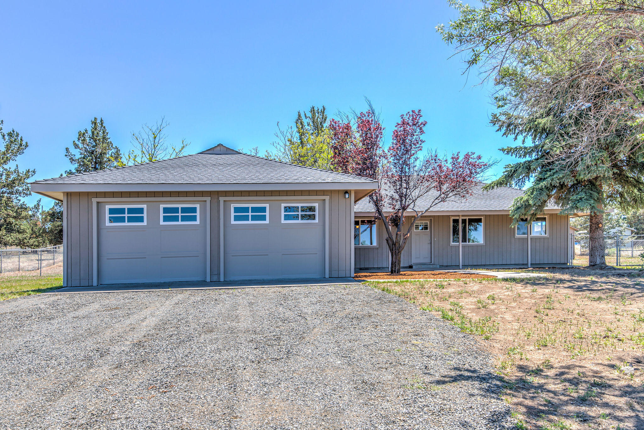 Move in ready!  This charming 3 bedroom, 2 bath, 1,853 sf home on 2 acres has been recently updated with new interior and exterior paint, engineered hardwood floors and stainless steel appliances.  There is an attached 2 car garage, a large fully fenced back yard with underground sprinkler system, in addition to a private well.  More than enough room for animals, in addition to RV parking.  This spacious property has potential for many uses.