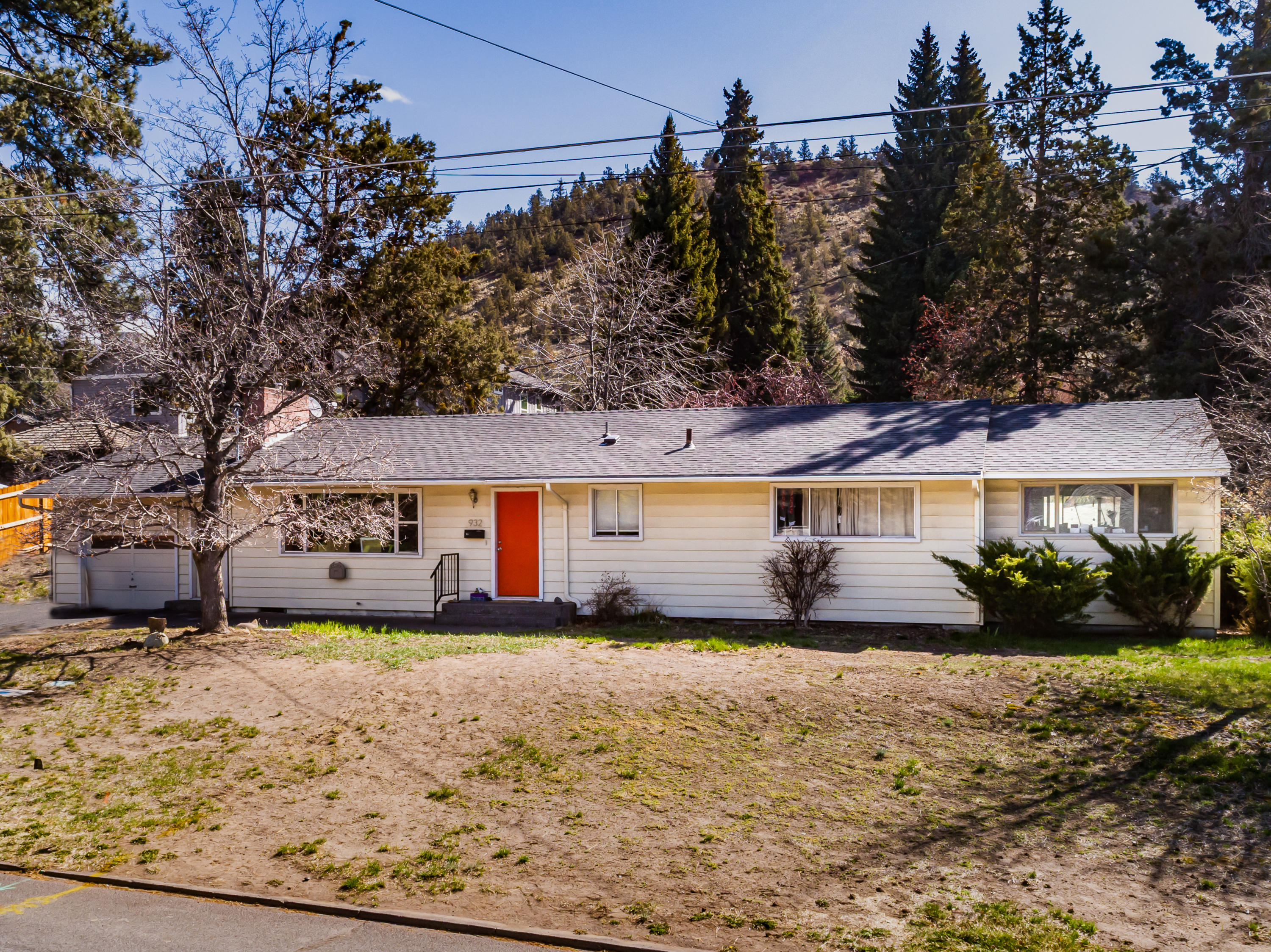 Super Mid-Town home on a DOUBLE LOT! This sweet ranch house features a nice open layout with a great room featuring a gas insert fireplace, open dining and kitchen. Primary suite at the south end of the house is really nice sized and separate from the living area. This home is 3 bedrooms, 2 full bathrooms, dedicated laundry room and HUGE front and back yards. Single car attached garage, ample driveway and on street parking. This location, neighborhood and home are super special and ready for someone to make them their own. *Buyer to do their own due diligence with regards to splitting the lot.*