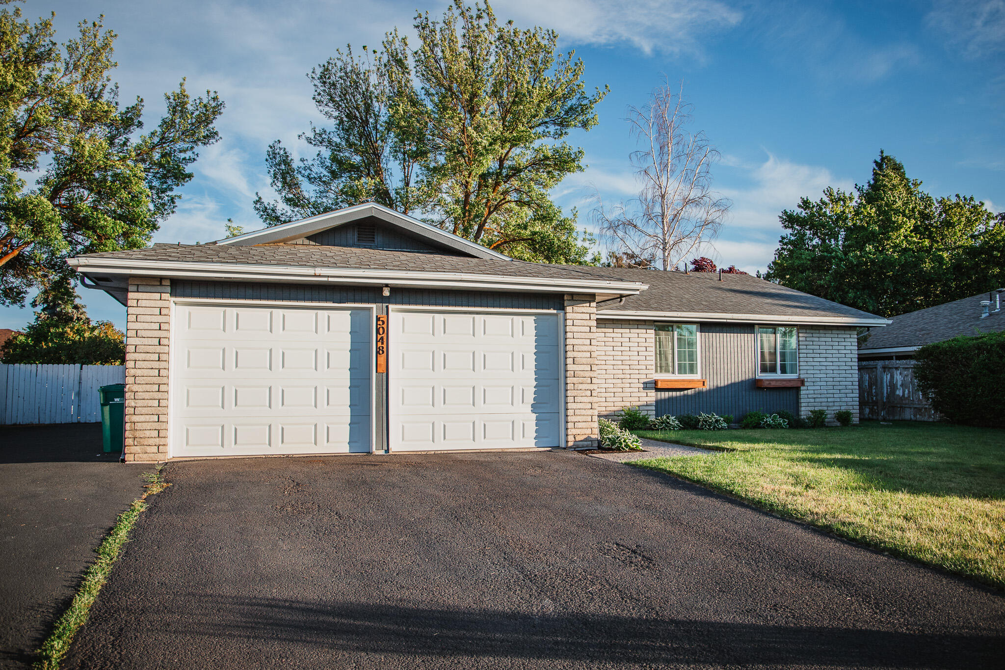 This beautifully renovated home offers vaulted ceilings and a spacious, open-concept layout that seamlessly connects the kitchen, living, and dining areas. Inside, enjoy new flooring, fresh paint, updated tile work, and modern fixtures throughout—every inch has been thoughtfully updated.
 Comfort is key, with a newer roof, forced air gas heating and air conditioning, and a high-efficiency air purifier.
 Step outside to find fresh exterior paint, eye-catching stonework, tidy front landscaping, a large off-street driveway, and space to park your RV or boat. The attached two-car garage adds even more functionality. Located in a desirable neighborhood, this home is a must-see!