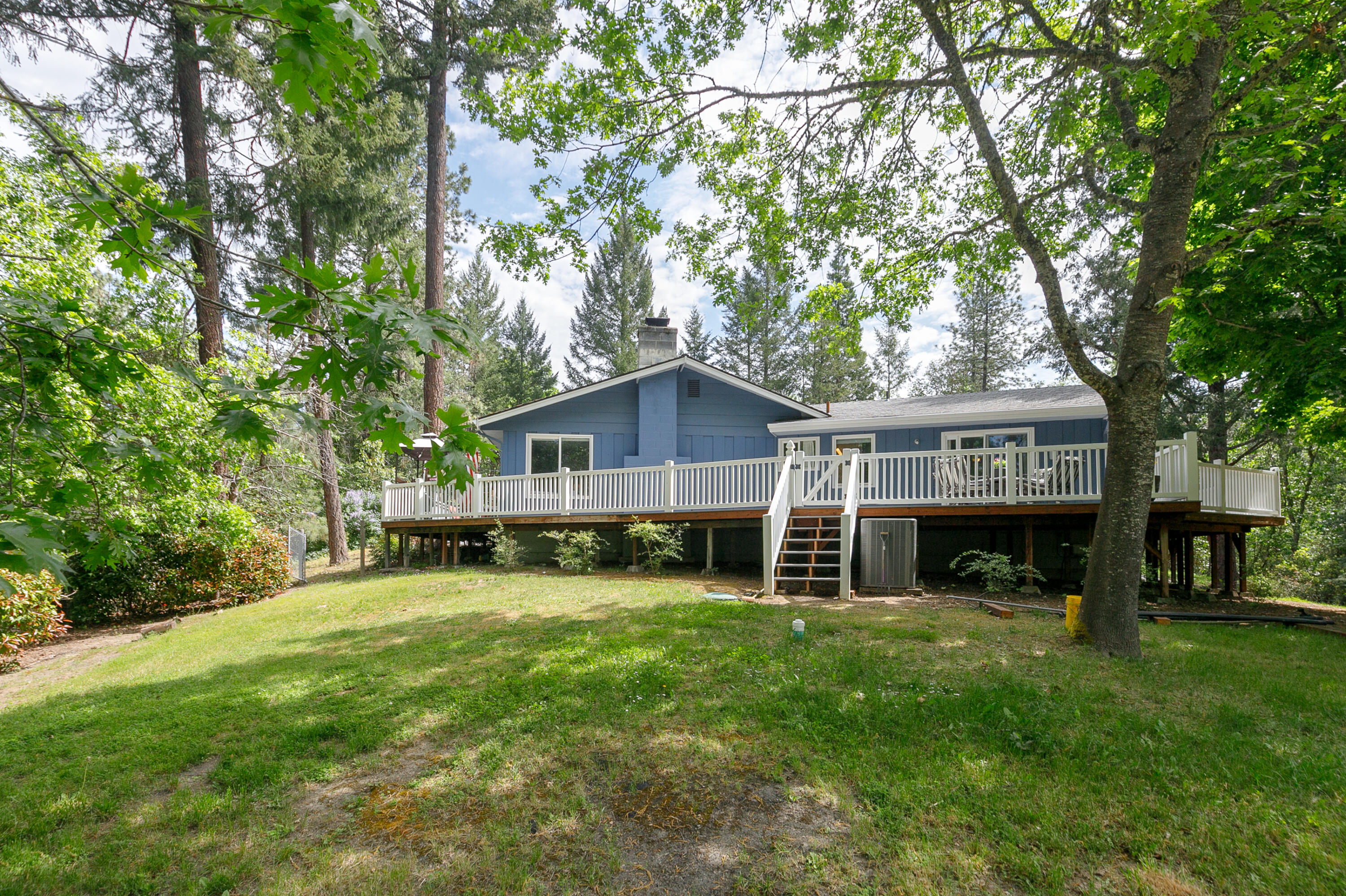 Location, Location, Location!
This one is calling your name! Located in the beautiful & desirable Country Club Heights subdivision. This home is set within walking distance to Cathedral Hills hiking trails AND the Grants Pass Golf Course! Just 10 minutes to the heart of Grants Pass with city schools and county taxes! What a score!
The home features a single story, open concept living space perfect for entertaining! The dining area steps right outside to the newly built, fully enclosed wrap around deck with beautiful wooded views! Interior features of the 2,364 SqFt home include 3 bedrooms, 2 full bathrooms with walk in showers & a jetted tub in the primary; a nice size kitchen with a dreamy commercial refrigerator; a game/media room ready to host and hang; and so much more! Outside you'll find a detached 2 car garage & a fenced in garden area with lots of sunlight exposure. With its prime location and a little bit of everything, this is the perfect place to call home!