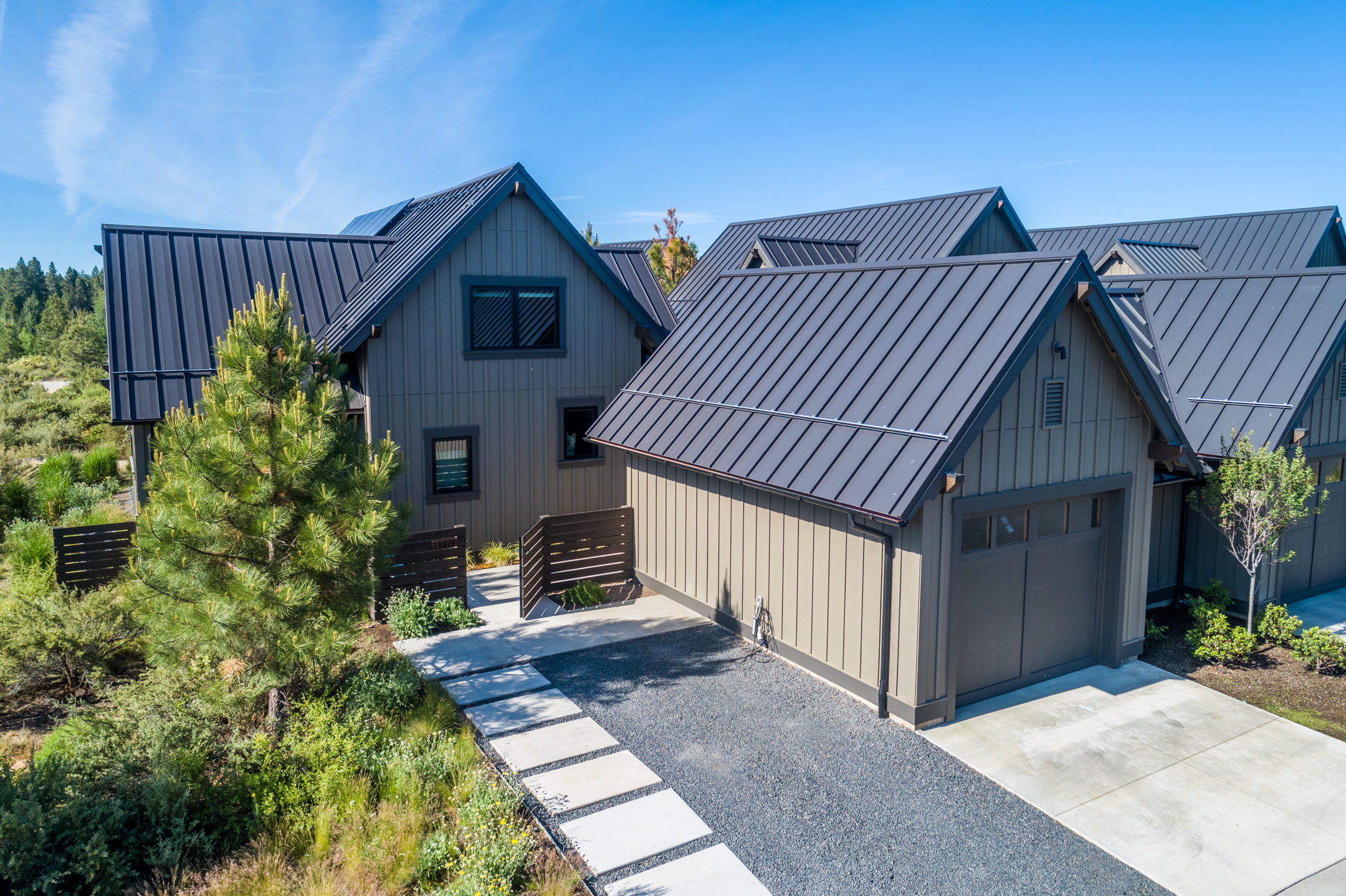 Beautiful light and bright Rustic model Tetherow Cabin perfectly located at end of street creating a private setting overlooking Alpine Park. Two master suites one on main level, and one upstairs. This Earth Advantage Gold Certified home has over $37,000 of upgrades that include a 5KW Solar PV System and electric car charger. Open concept chef's kitchen with high end Kitchen Aid appliances, solid surface counter tops, custom cabinetry, vaulted ceiling great room, wide plank French oak hardwood flooring, stone and onyx vessel sinks, freestanding soaking tub, and fire pit on the private patio are just a few of the outstanding features of this special home. Large detached garage with extra storage to easily store all outdoor toys. Just a short distance from Tetherow Golf and Clubhouse, Tetherow Restaurants, Tetherow Sport facility, Phil's Trails, Mt. Bachelor, Cascade Lakes, and the Deschutes River Trail. Perfect launching point to all the outdoor amenities of Central Oregon.