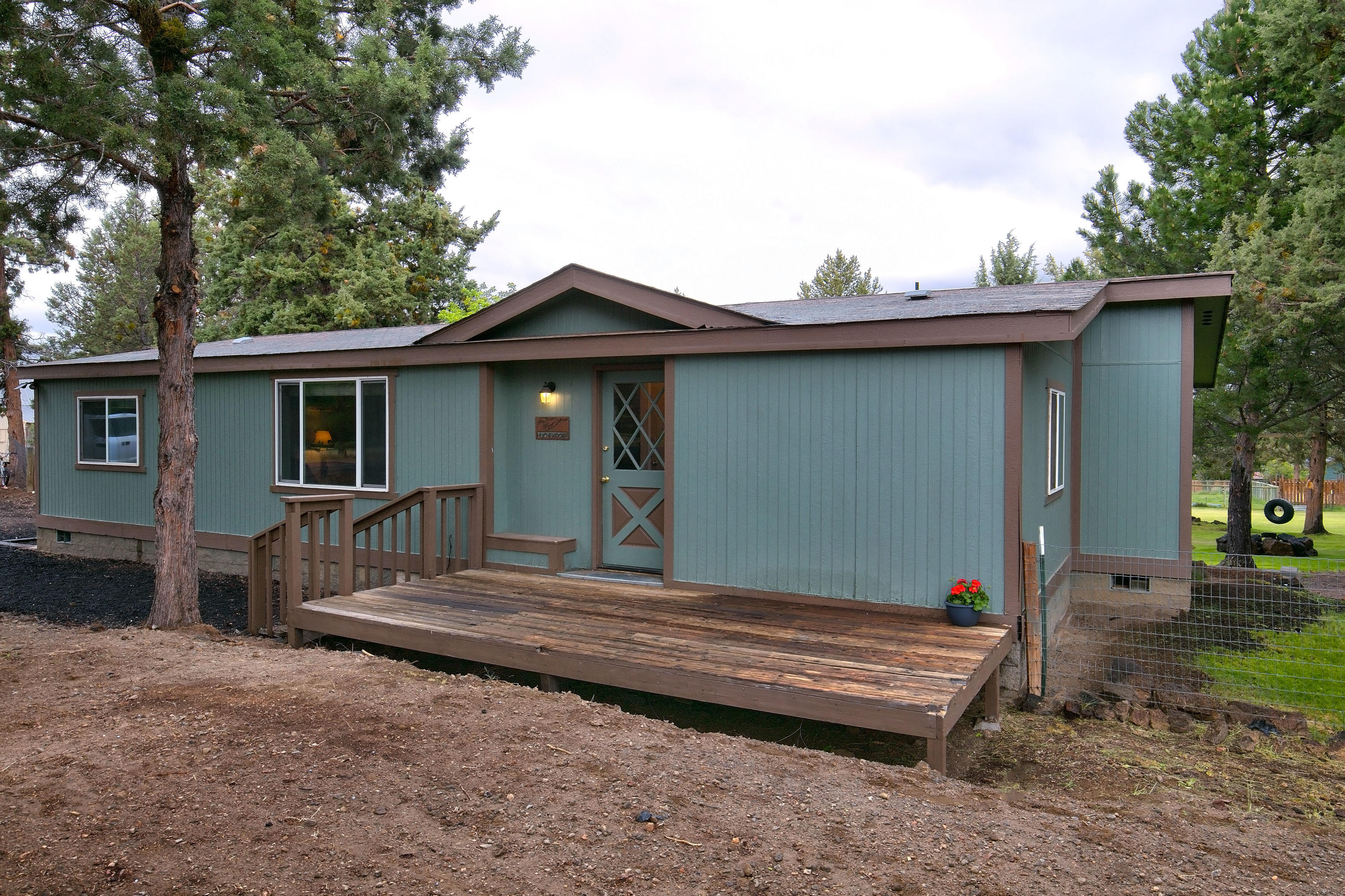 Enjoy peaceful, private Tumalo living on this fully irrigated 1.01 acre oasis with mature trees, large pond, detached two car garage/shop, shed with power and lots of storage. Many recent improvements to this charming single-level, three bedroom, two bathroom home including A/C, new wood stove, upgraded Brazilian cherry kitchen cabinets, upgraded appliances, new carpet and laminate flooring. You will not find a more perfect backyard for family adventures: swing from the tire swing, climb and explore around the tree house and play area, enjoy endless evenings together by the fire pit making s'mores and watching the sunset together. Room for RV parking. Easy access to Hwy 20 and Hwy 97, 2 minutes to Target, Trader Joe's, Starbucks, restaurants and shopping. Don't miss out on this opportunity to own a little piece of paradise in Bend.