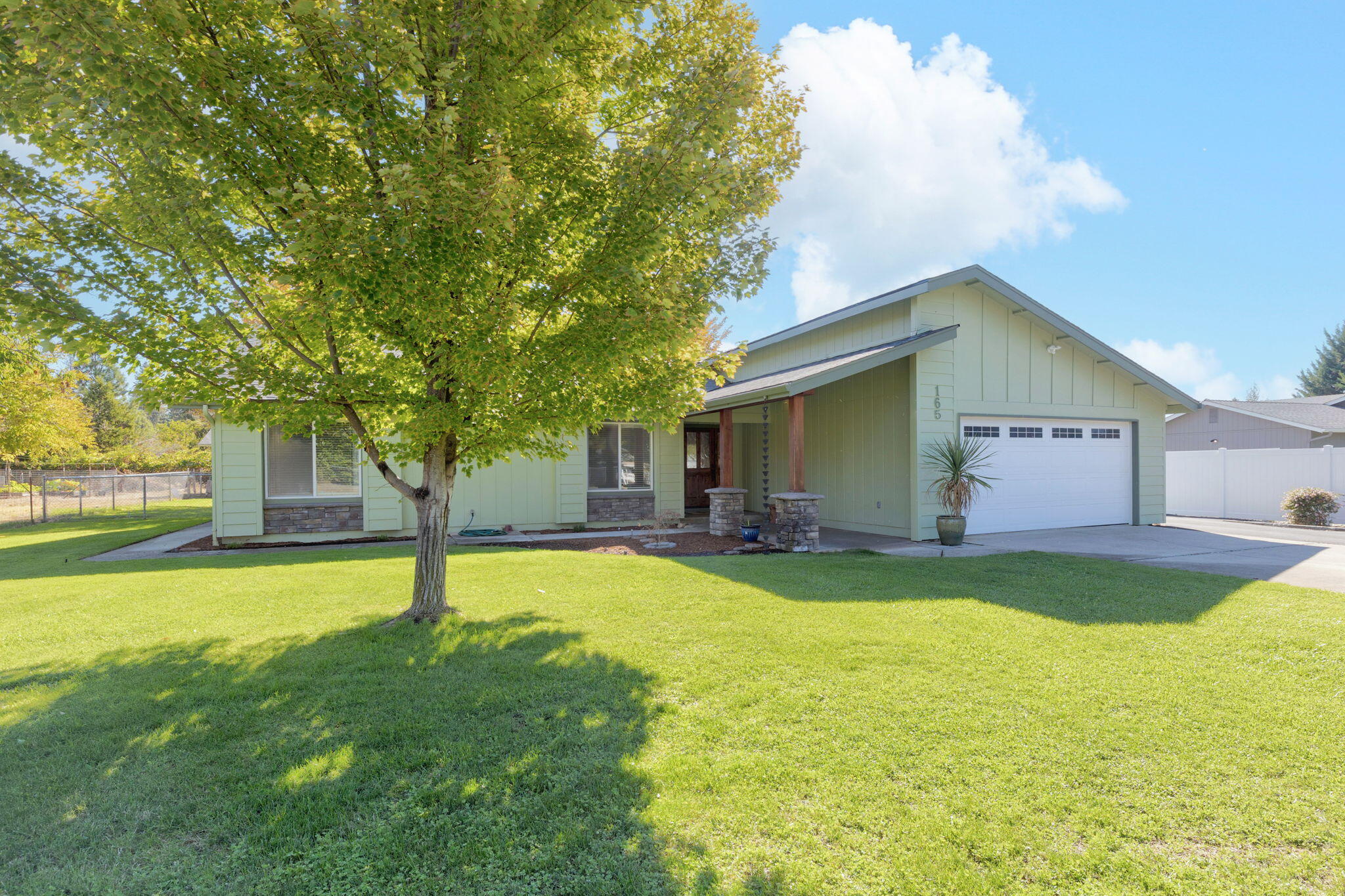 Welcome to this beautifully updated home blending modern comfort w/Southern Oregon's rural charm. Tucked away towards the end of a peaceful cul-de-sac, situated on 1.31 level acre, sits this 1,624sqft 3bdrm 2bth. Offers an open floor plan w/luxury vinyl plank flooring throughout. A stunning kitchen features leathered granite countertops, large island, soft-close cabinetry, stainless steel appliances, double convection oven, Spacious living room features a cozy wood burning stove, w/double sliding glass doors that open to a welcoming backyard retreat ideal for outdoor living & entertaining. Updated bathrooms include new vanities w/granite countertops, deep soaking tub in guest bath, tile shower in Primary. Energy-efficient upgrades, newer roof & HVAC system, blown in insulation in attic! UV water purifier & water softener. Attached 2-car garage, detached 760 sqft shop has bonus room w/ possible ADU! This exquisite gem includes a fenced yard, garden. chicken coop & mature orchard!