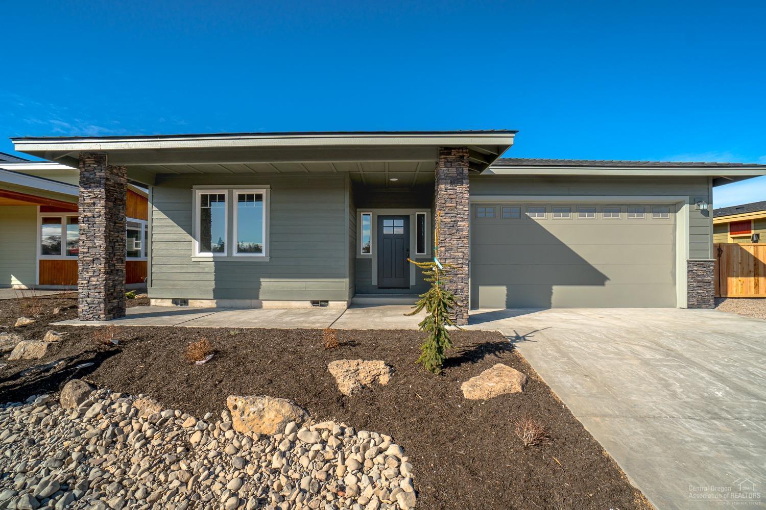 Canyon Rim Village + Quality Construction + Great Layout + Affordable Luxury = WIN! Situated in NW Redmond just off the Dry Canyon, this home offers the craftsmanship & thoughtful design found in every Dunlap Fine Homes build. This expansive, single level home features spacious living spaces & over sized bedrooms & baths. Great Room layout w/attractive, open Kitchen featuring a central island that is every chef's dream! Plenty of prep space & storage, Quartz slab counters & full height backsplash. SS farm sink, gas range & dishwasher, pantry w/space for all your extras. Living space offers a cozy corner Gas burning fireplace w/stylish accents & room for gathering. Desirable Master separation, walk in closet, step in shower & dual vanities. 2 additional guest rooms off the entry, Laundry room w/storage & folding table too! Durable wood look laminate flooring, carpet in the bedrooms & luxury vinyl plank in baths.Gas forced air, A/C & fully fenc