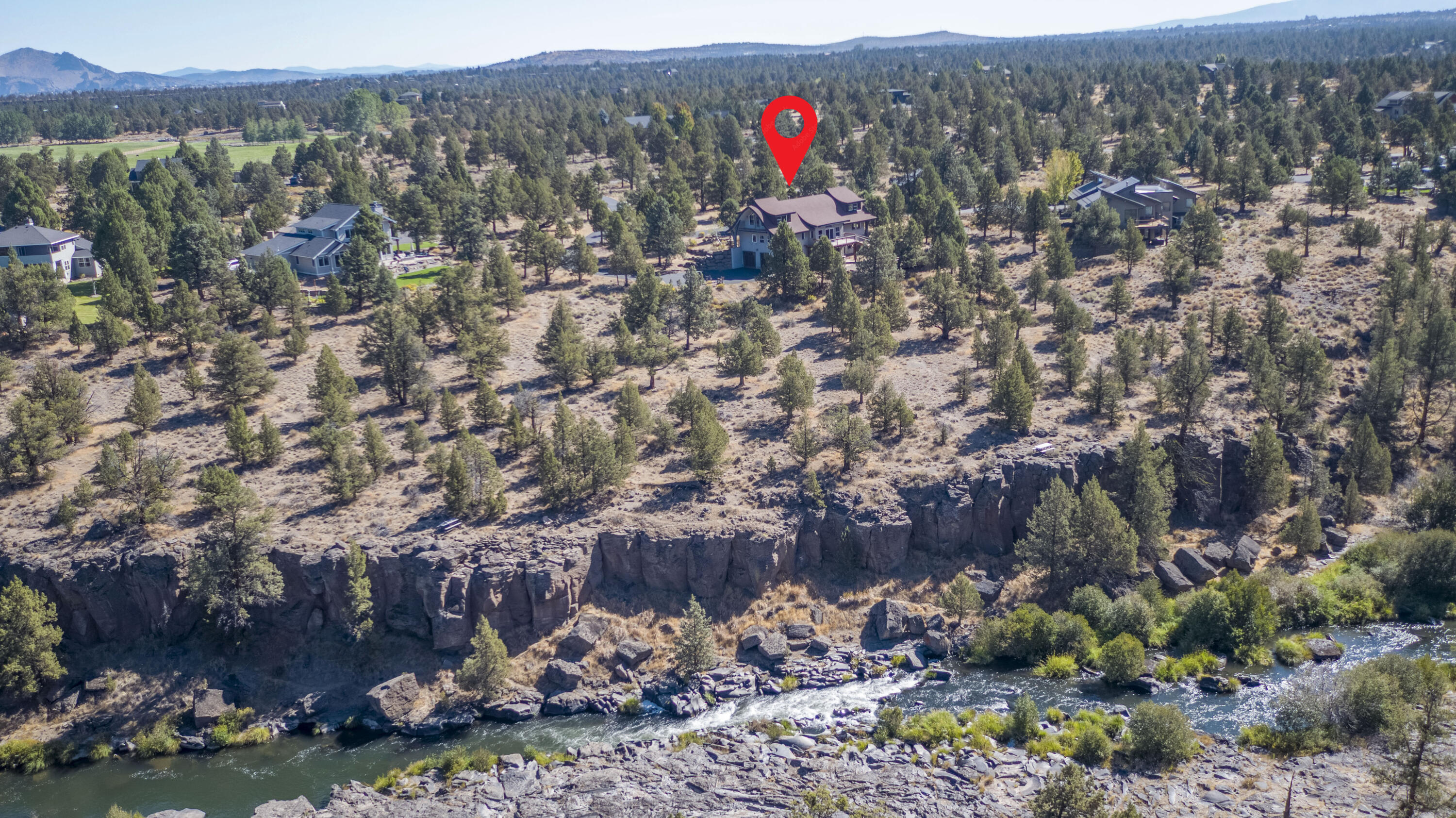Discover this remarkable 4,248 sq. ft. custom home set on 2.54 acres in the sought-after Odin Falls Ranch community.  Designed with privacy and comfort in mind, it features 3 bedrooms, 3.5 baths, and expansive living areas with vaulted ceilings.  The chef's kitchen is ideal for culinary creativity while the large Trex deck provides the perfect backdrop for gatherings and breathtaking Cascade Mountain views.  Nestled behind a secure gated entrance this home blends craftsmanship, tranquility and luxury.  This home offers exceptional value for the space and quality at only $282.25 per sq. ft. an outstanding opportunity in Odin Falls Ranch.