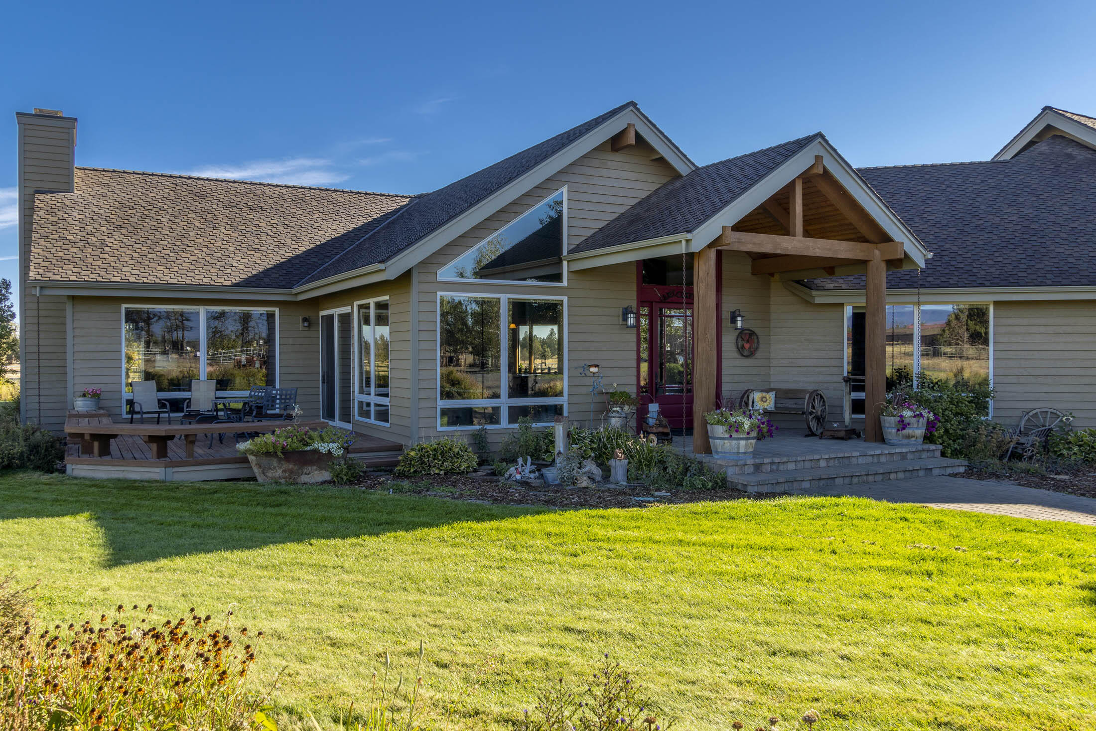 Spectacular one of a kind,  NW style home with magnificent mountain views.  Enjoy picturesque views from every window of this executive home.  Located on 10 acres,  completely fenced, x fenced & gated.  5  acres of irrigation rights with four stall barn, tack & work room & hay storage.  Home has a wonderful open floor plan w/ vaulted ceilings, log pillars, floor to ceiling windows & huge stone fireplace in the great room. Perfectly set up for your entertaining.  The kitchen is well thought out in design and function.  From SS appliances, upper/lower cabinet lighting, gas cook top, warming drawer, huge pantry, granite counter tops,  and a large island for gathering.  All bedrooms located on main level with two full baths, big windows, and deck off main bedroom.  Bonus room upstairs is large and separate from main living space, could be used for bed room, media, or office space. This equestrian/hobby farm is move in ready for your Central Oregon lifestyle.