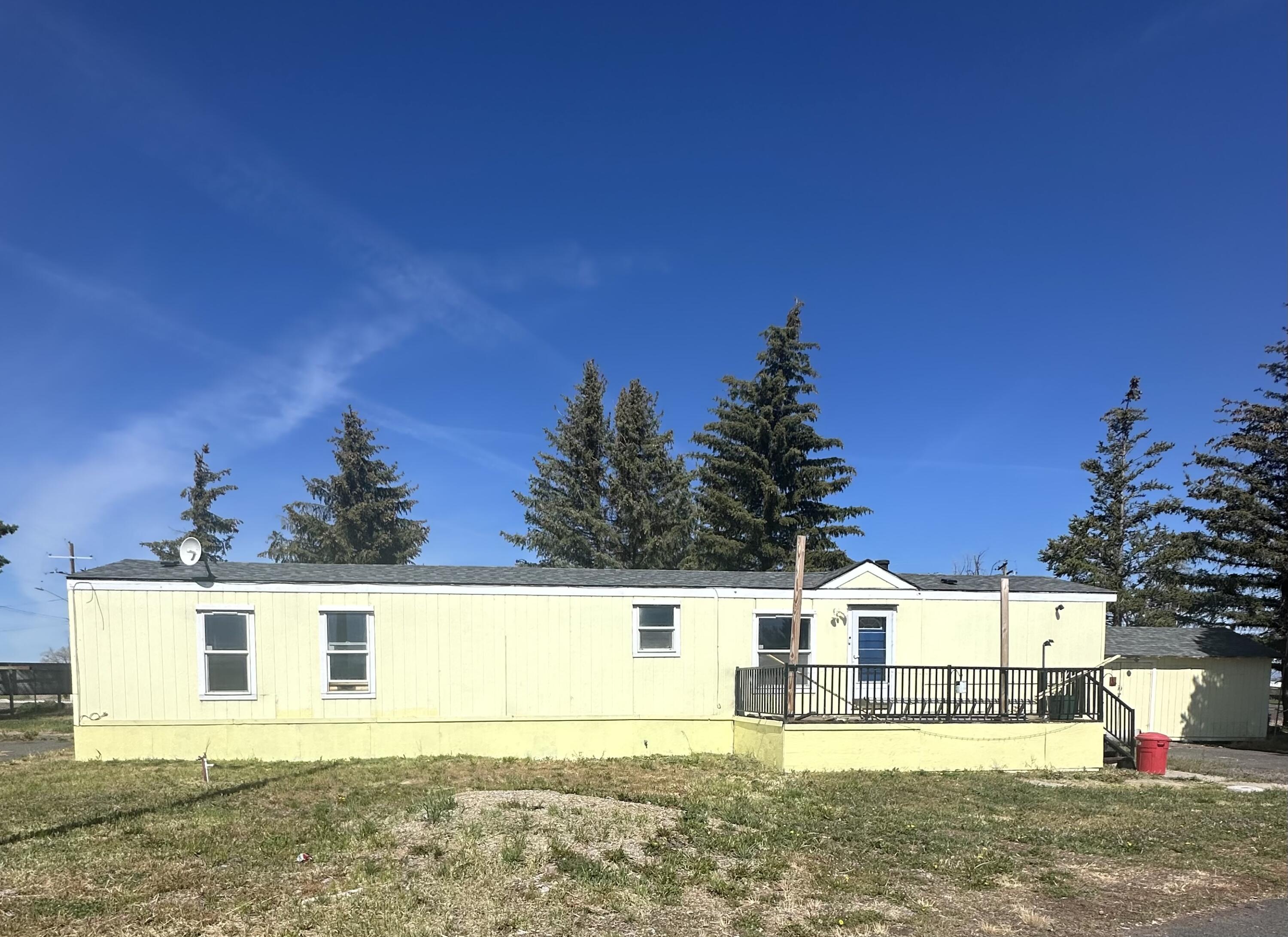 Welcome to this move-in ready 2 bedroom, 2 bathroom home located in a quiet and established mobile home park. This home offers a spacious open layout with updated flooring, LED lighting, and plenty of natural light throughout. The kitchen features ample cabinetry, and room for a dining area. The large primary suite includes a walk-in closet and attached bath with a walk-in shower. Enjoy peace of mind with a roof that's less than 3 years old. Outside, you'll find a large front deck, a ramp for easier access, a large shed, and a 12x20 building with electric and A/C—perfect for a workshop, studio, or extra storage. Affordable living with a fresh feel—schedule your showing today!