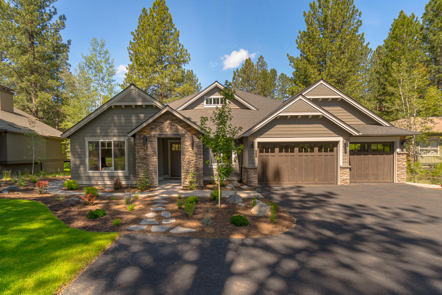 Modern farmhouse aesthetic located in the westside neighborhood of Widgi Creek! Custom built home completed in 2019 by award winning builder and situated on a .39 acre lot with a pond and mature trees. White ship lap walls, 12' tall vaulted ceilings and rough sawn oak floors, large picture windows fills this home with natural light. The oversized quartz topped kitchen island is a place everyone loves to gather. Primary bedroom includes a spacious bathroom with a soaking tub and oversized tile shower. Guest-suite with private full bathroom is perfect for hosting guests. A large bonus room with a vaulted ceiling is a great place to watch movies, workout or use as a 5th bedroom. Numerous built ins and closets for ample storage located throughout the home. Triple-car garage with epoxy coated floors. Easy access to Mt. Bachelor (20min), Old Mill and downtown.  No need to drive to enjoy the Deschutes river trail and the numerous mountain bike trails that are accessible from the neighborhood