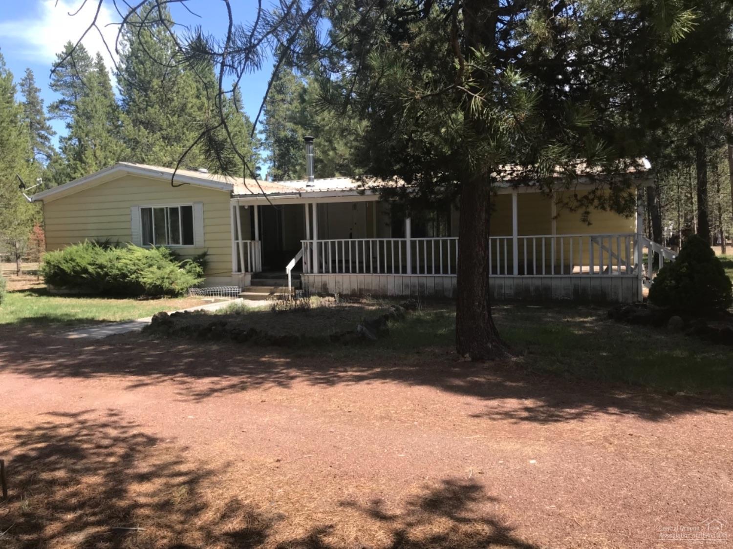 Great Opportunity to Own This 3 Bedroom 2 Bath Mfg Home. Built in 1979, has 2097 sq ft, which makes it very Roomy. Home has an Open Floor Plan with a Living Room, Family Room and a Dining Room. Utility Room with Sink and Countertop. 2 Full Bathrooms, 1 with a Garden Tub. Newer Certified Wood Stove. Covered Front Porch. Nice 30x40 Shop with Concrete Floor, Pump House with Storage,all on 1.22 acre lot. Newer 1000 Gallon Concrete Septic. Give this Home a little TLC and Turn it into your Family Home.