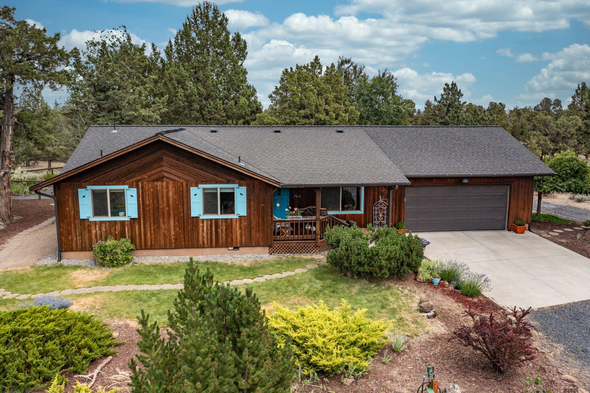 Rare opportunity to enjoy peace & tranquility in the Boonesborough neighborhood! This charming 2 bed, 2 bath single story home w/ an office/den offers 1,486 SqFt of living space on a spacious 2.52 acre lot that backs up to BLM land. As you enter you will find an open floor plan w/ beautiful hardwood throughout the home. In the great room there is a propane fireplace, vaulted ceilings & a solar tube. The kitchen has a new range, countertops & sink, There is a large pantry & under cabinet lighting. You can access the amazing fenced backyard from the primary bedroom or living room slider or from the massive laundry/mudroom that has a utility sink. Out back, you'll find a peaceful waterfall with a pond, a covered back deck, a paver patio, a hot tub & a storage shed. In addition there is central vac, new air filtration system, new water heater, RV parking, new septic 4/2019 & 2 car garage w/ workbench & tons of storage. Don't miss the chance to make this peaceful retreat your home!