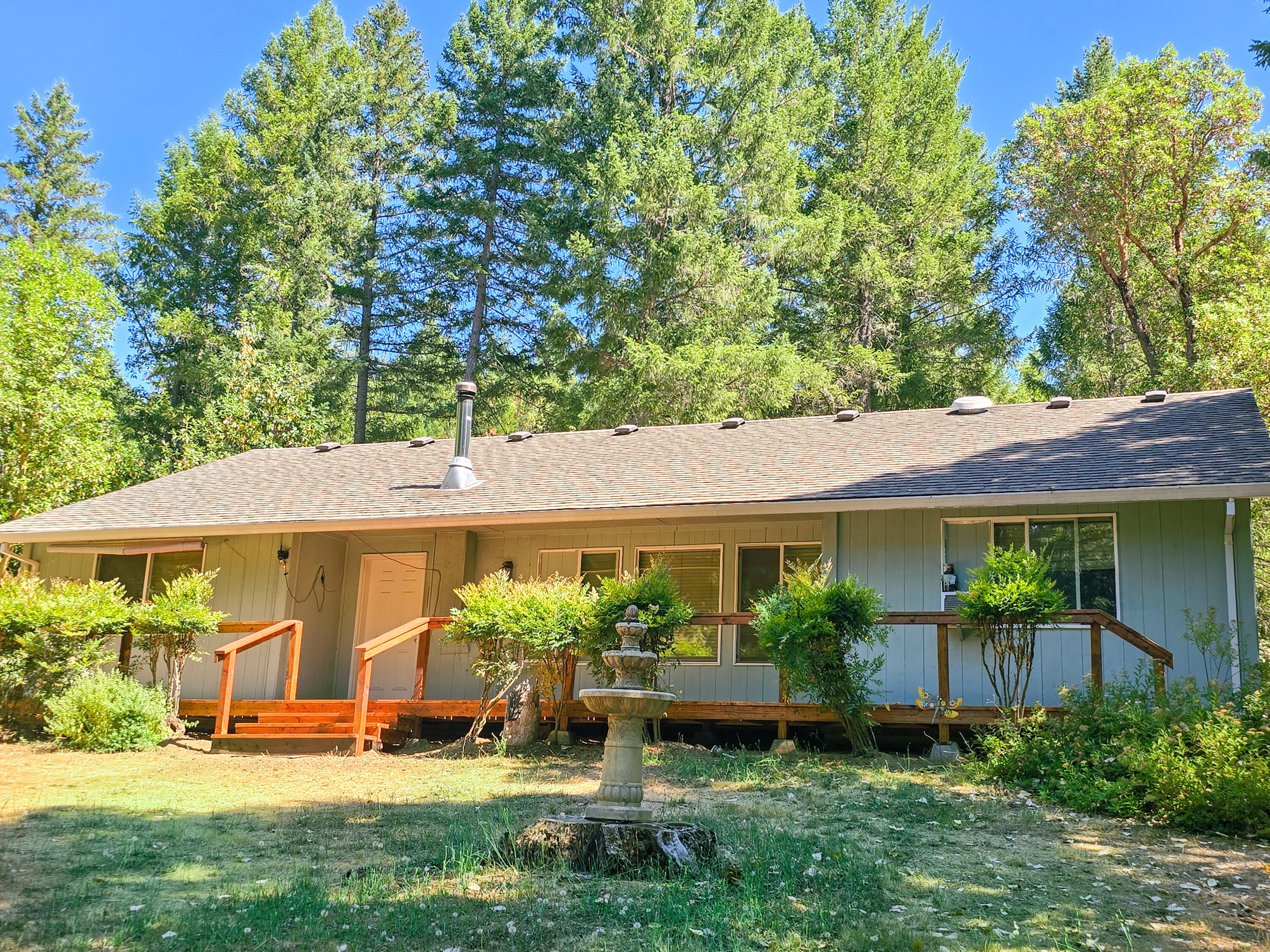 Private Retreat Awaits! Charming 3BR/2BA stick-built home nestled among towering trees. Open floor plan creates ideal space for relaxation & entertaining. Peaceful treed setting provides privacy near lake. 
GAME CHANGER: Massive shop (1140 sq ft) perfect for hobbyist, entrepreneur, or storage - ideal for home business, woodworking, or toys. Large bay doors for drive through, great craft room and a dumwaiter for easy movement of items from 1st to 2nd floor! 
Rare combination of comfortable home & functional workspace in private forest setting. Escape the hustle and bustle while staying connected to lake activities and natural beauty.