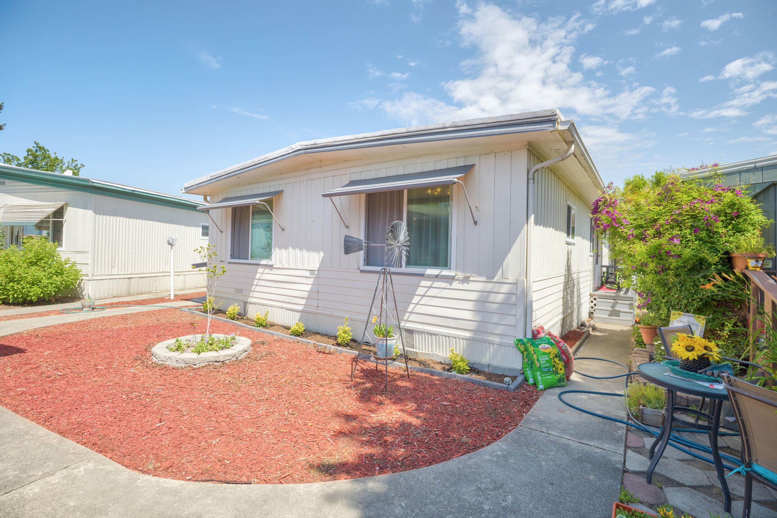 You will love this updated two bedroom, two bath, 1344 SqFt home. The spacious  living room, family room and formal dining area provides plenty of extra room and natural light. This home has been freshly painted with updated bathrooms, walk-in closets and built in storage.  Located in Roguelea Estates, Grants Pass' premier 55+ manufactured home community sits right along the mighty Rogue River. Living in this community you will have access to a private park along the river where you can watch the famous jet boat races, enjoy river wildlife, and have picnics with your friends and family. The beautiful lake offers trout and bass catch and release fishing. The Clubhouse offers a variety of activities and can be reserved for private parties. The park does allow pets. All applicants must be approved by park management. Come see this home today!