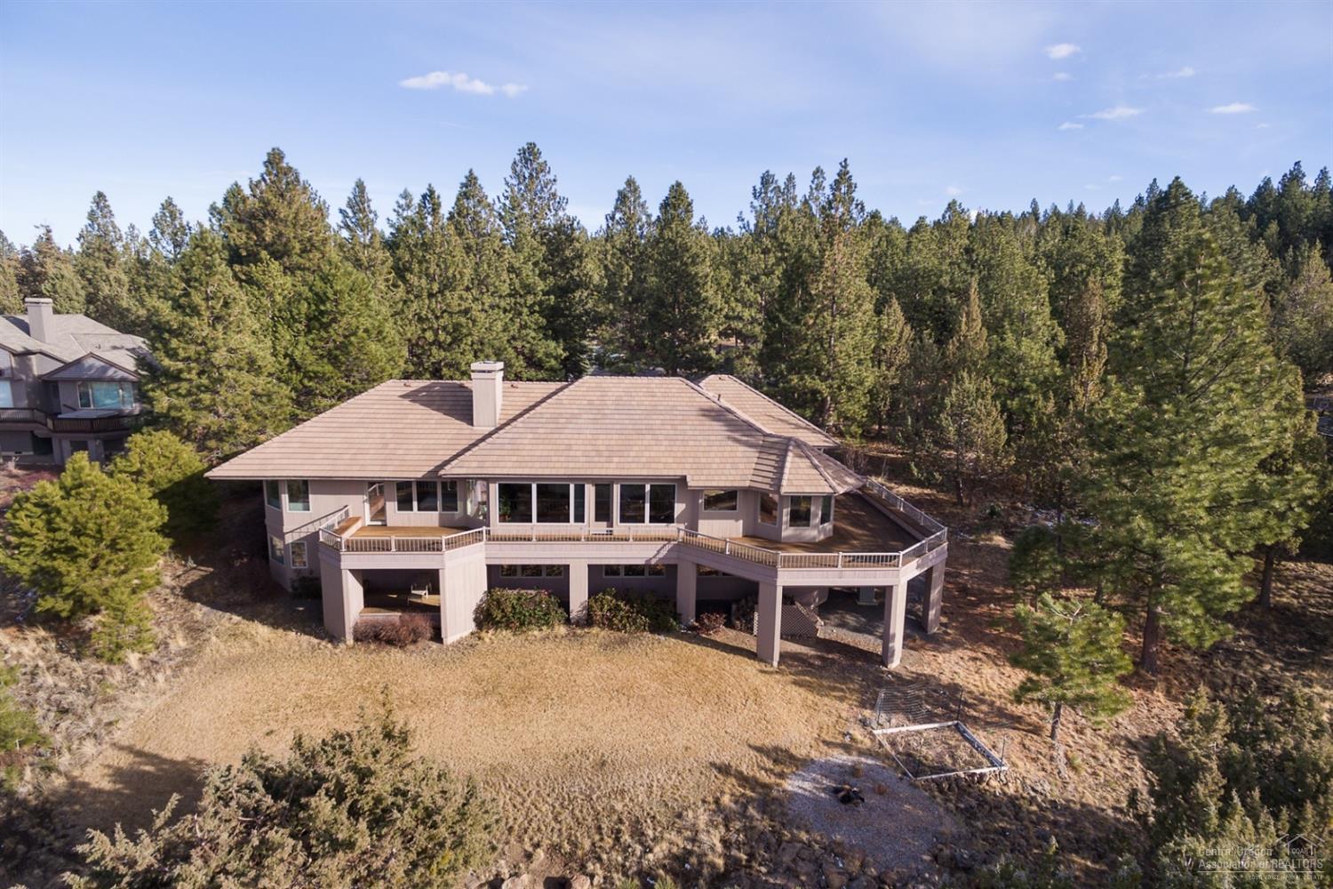 7-Peak Cascade Mountain Views steal the show at this fabulous Awbrey Butte home on a quiet cul de sac. Main floor master & office with 3 addl. bedrooms & bonus room on daylight basement level. The large entertaining room features dining, fireplace seating & picture windows to capture the views. The cook will keep good company with a cozy fireplace area adjacent to kitchen island seating plus a sunny breakfast nook. Enjoy the expansive wrap-around deck; courtyard entry; tons of storage & 3-car garage.
