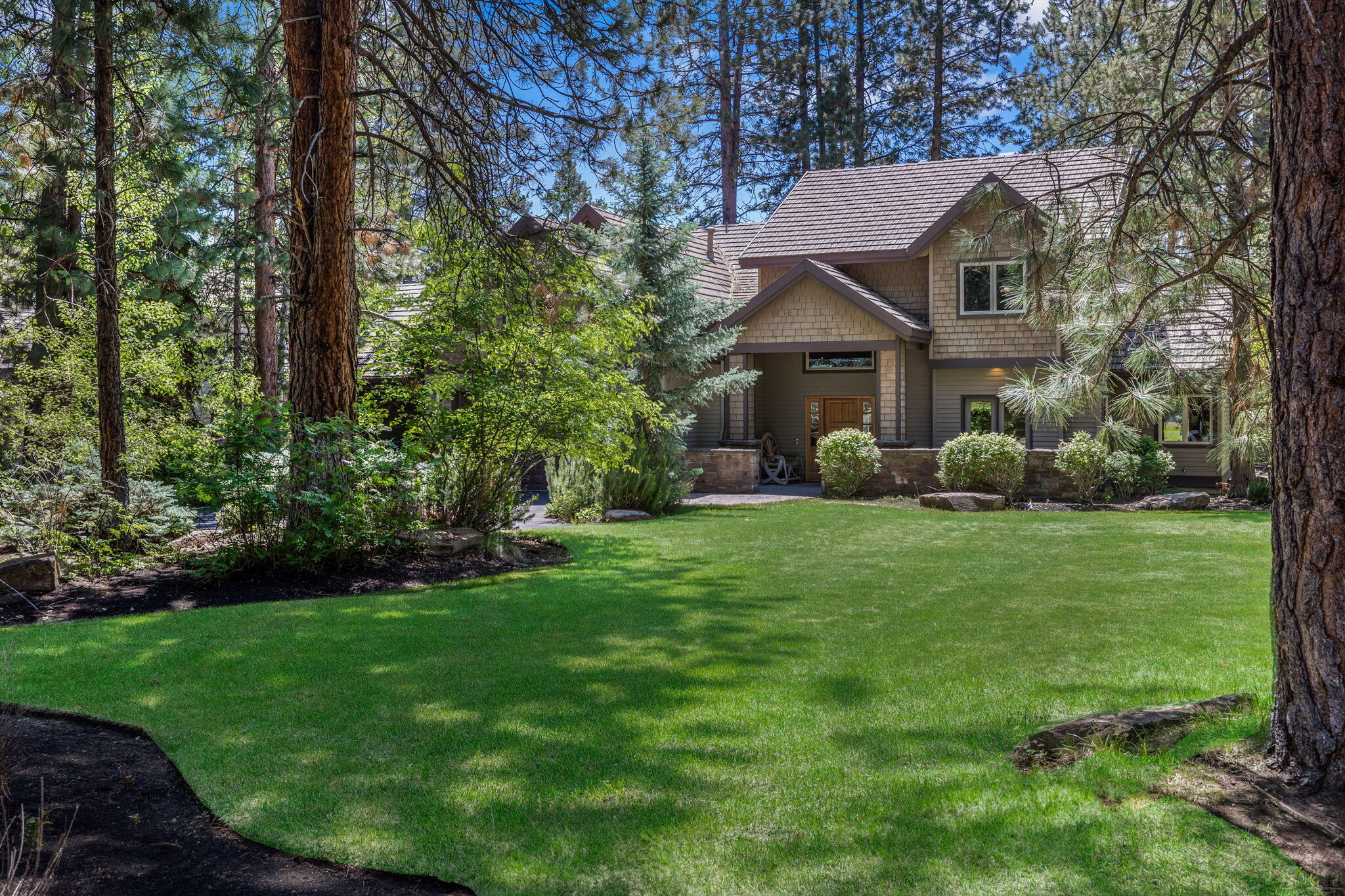 Stunning golf course home on the 7th fairway in Broken Top. This home features an open floor plan with a towering great room and beautiful gas fireplace. The chef's kitchen boasts a 48'' Viking range, huge Thermador refrigerator, a large island has bar seating and a prep sink. The master suite is situated on the main floor with a walk-in closet, double vanity, enclosed toilet, walk-in tiled shower and outdoor hot tub with private entrance. Upstairs there is a large game / media room, 3 bedrooms, 2 full bathrooms, loft and a 2nd laundry room. Enjoy outdoor Bend living from the expansive paver patio overlooking the fairway with common area across for an open protected view. Other features include an office, 3 car garage and beautiful built in cabinetry.