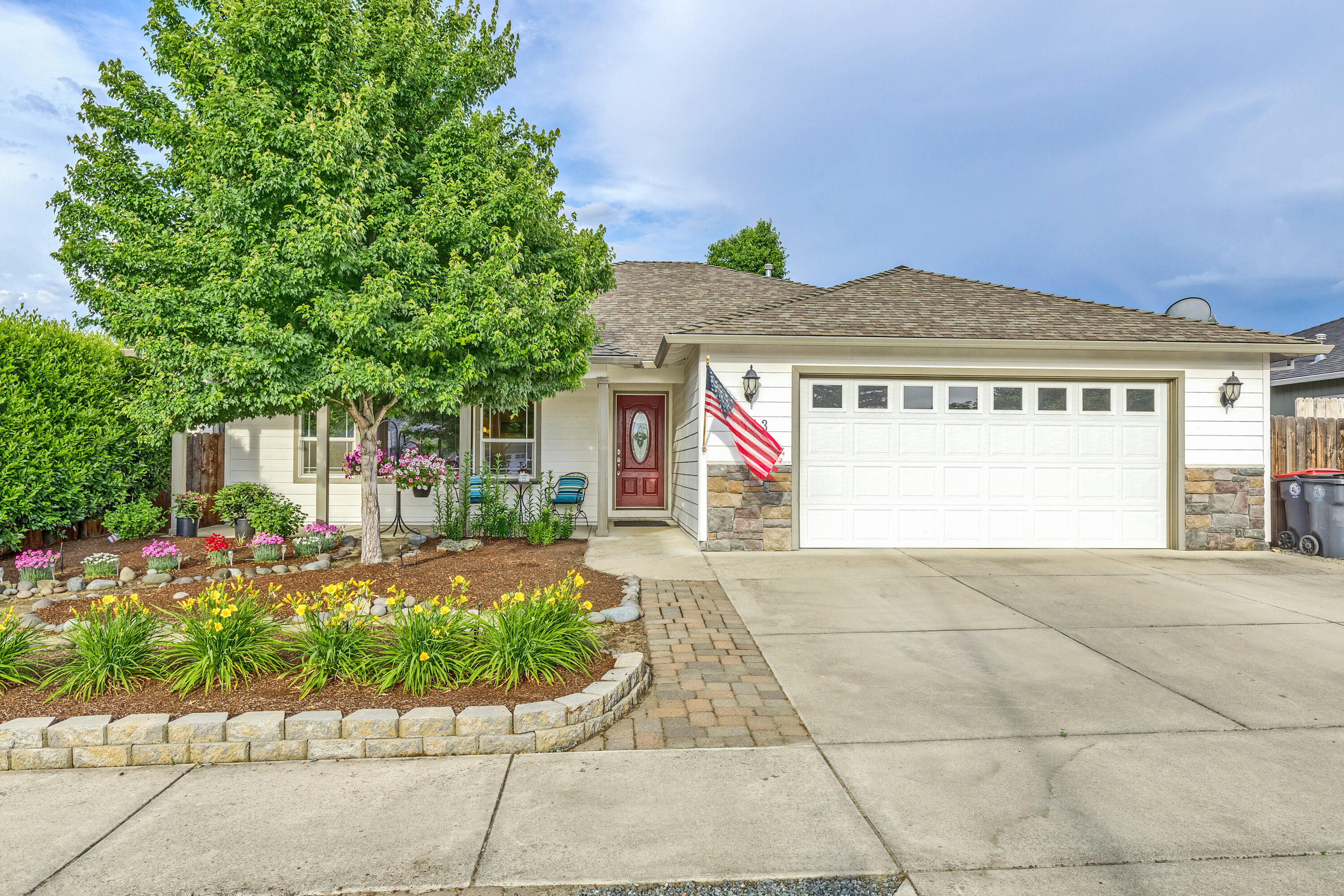 Prepare to be impressed! This home defines IMMACULATE inside & out!	Spacious open great rm w/ vaulted
ceilings, beautiful light, bright kitchen w/ white cabinets, granite counters & breakfast bar.	The master suite is spacious & peaceful. You'll find french doors opening to the back yard, jetted tub w/ tile surround, large stall shower & double vanity. The other 2 bdrms are of good size & the hall/guest bath has a tub/shower combo w/ single vanity. French doors from the dining area lead to the beautiful back yard w/ wonderful landscaping, covered patio, extended paver surface, artificial grass & water