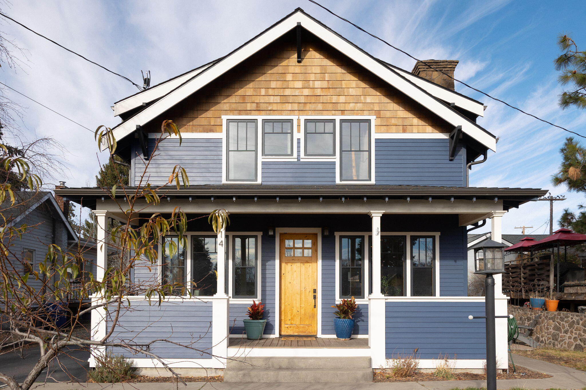 Stunning Craftsman style home in the heart of downtown Bend, blending timeless architecture with elevated modern living. This 3-bedroom, 2.5-bath residence offers premium finishes, engineered hardwood flooring, custom fir trim & doors, and warm living space centered around a wood-burning fireplace. The gourmet kitchen features mahogany cabinetry, JennAir range with downdraft, wall oven & instant hot water. Thoughtfully designed for both comfort & functionality. Upstairs includes a versatile family lounge, linen storage, & serene primary suite with private deck, dual vanities, and tiled glass shower. Comfort features include gas furnace, heat pump, central AC, tankless Navien heater, and ceiling fans throughout. Beautifully designed ADU adds an additional bedroom, bath, and mini-split system. Outside, enjoy a covered front porch, two-car garage, and mature landscaping with fruit bearing trees. A rare blend of exceptional craftsmanship & comfort steps from all downtown has to offer.