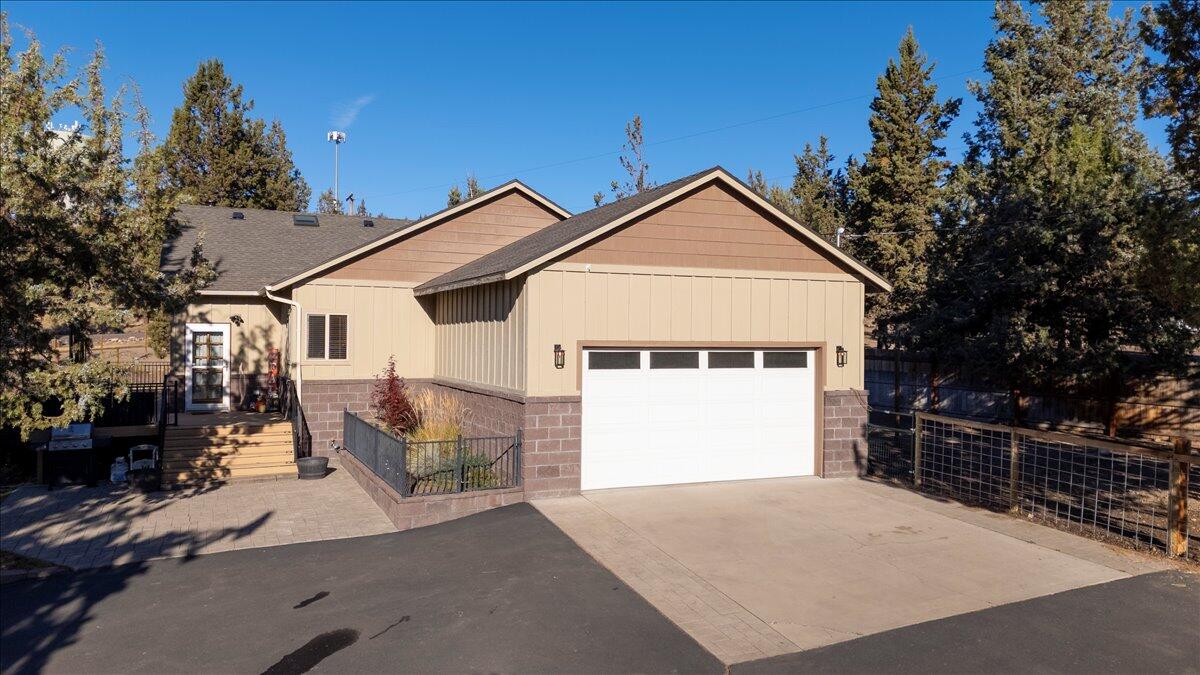Custom Single-Level Home with Shop & Acreage in Crooked River Ranch! Beautifully crafted 3-bedroom, 2- bath single-level home featuring vaulted ceilings, new woodstove, and stunning Hickory hardwood floors. The kitchen is a delight with knotty alder cabinetry, granite countertops, and a spacious layout ideal for entertaining. Additional highlights include a central vacuum system and an attached 2-car garage. Outdoors, enjoy a paved asphalt driveway, full RV hookups, and a massive 36x50 shop equipped with 50-amp and 220v power-perfect for hobbies, storage and toys. The fully fenced and gated 1.01-acre property offers two separate fenced areas, ideal for horses or livestock. Experience comfort, function, and country living at its best in this Crooked River Ranch gem.