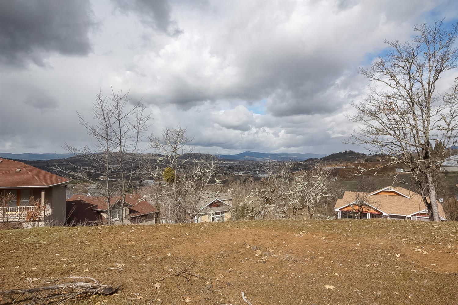 Beautiful view lot in the Eagle Point Golf Course with some work already done. Quiet location, lot is leveled off and ready for your new home. Shared private paved access to this lot. SHOW AND SELL!!!!!