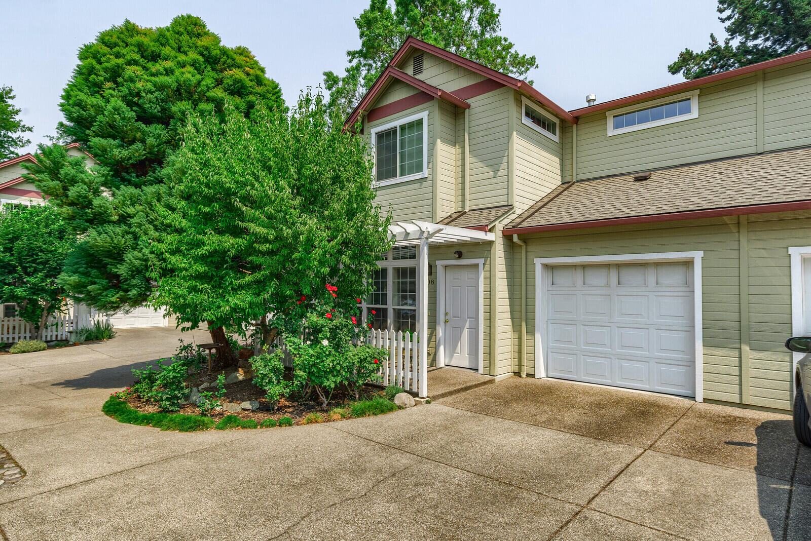 Wonderful, well-cared for townhome in the highly desired Court of Mary Jane community. This 1917 s.f. home sits on the interior of the development, creating privacy and quiet. A lovely front porch welcomes guests into the open concept living area. The living room has a gas fireplace and is filled with natural light. The kitchen has solid wood cabinets and opens to a sweet back patio, making entertaining an ease. A spacious primary bedroom sits on the main floor and has an en suite bathroom, sliding glass door and a walk-in closet. Upstairs opens to a large vaulted media/family room that is the perfect getaway or even a home office. Two additional bedrooms share another full bathroom, rounding out this wonderful space. This home is located on a quiet street that is close to the shops of south Ashland, the YMCA, bike path and many trails. Truly a unique opportunity for easy Ashland living in a fantastic location.