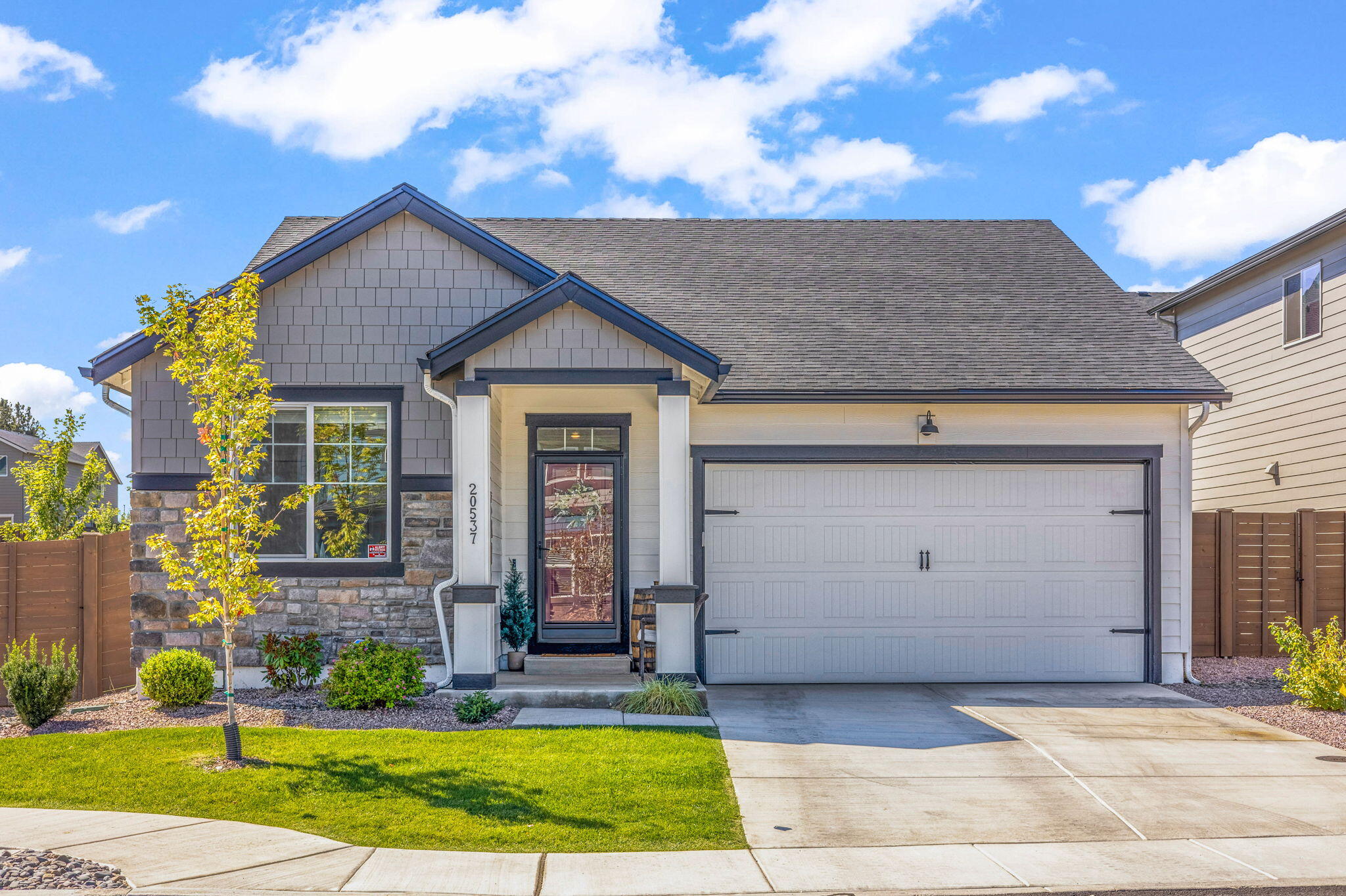 Better than new 1,435sf home in Stone Creek! Corner lot provides extra open and bright feel to this beautiful home. Glass storm door and LVP floors welcome you in, and the kitchen will keep you here! Matte white GE Cafe appliances, modern painted cabinets, quartz countertops, gold hardware, and the cutest pantry make this space the true heart of the home! Large dining space and island seating offer plenty of room for entertaining; open living room w/ electric fireplace keep things cozy and homey. Two bedrooms located at front of home, w/ Primary suite tucked away at the back - creating great bedroom separation for families, guests, or home office set up. Primary en suite w/ dual vanity and walk-in featuring California Closet systems completes this restful space. Step out to the back patio and Trex deck with well planned landscaping - perfect for evening cocktails, morning coffee, or a pup hangout anytime! Located just one block from CO Canal Trail and 1/4 mile from Silver Rail Elem!