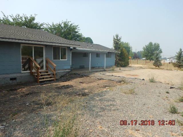 Nice quiet end of road location in rural Central Point. Newer roof, new range/oven, exterior siding has been repaired, so much room inside ! Large living room, separate huge family room, bonus room, 2 masters - 1 updated with newer soaking tub and stall shower, just needs your TLC to make this house your 'home sweet home'. Great well and public sewer service this nicely located home.(Well flow shows 14.5 gpm)