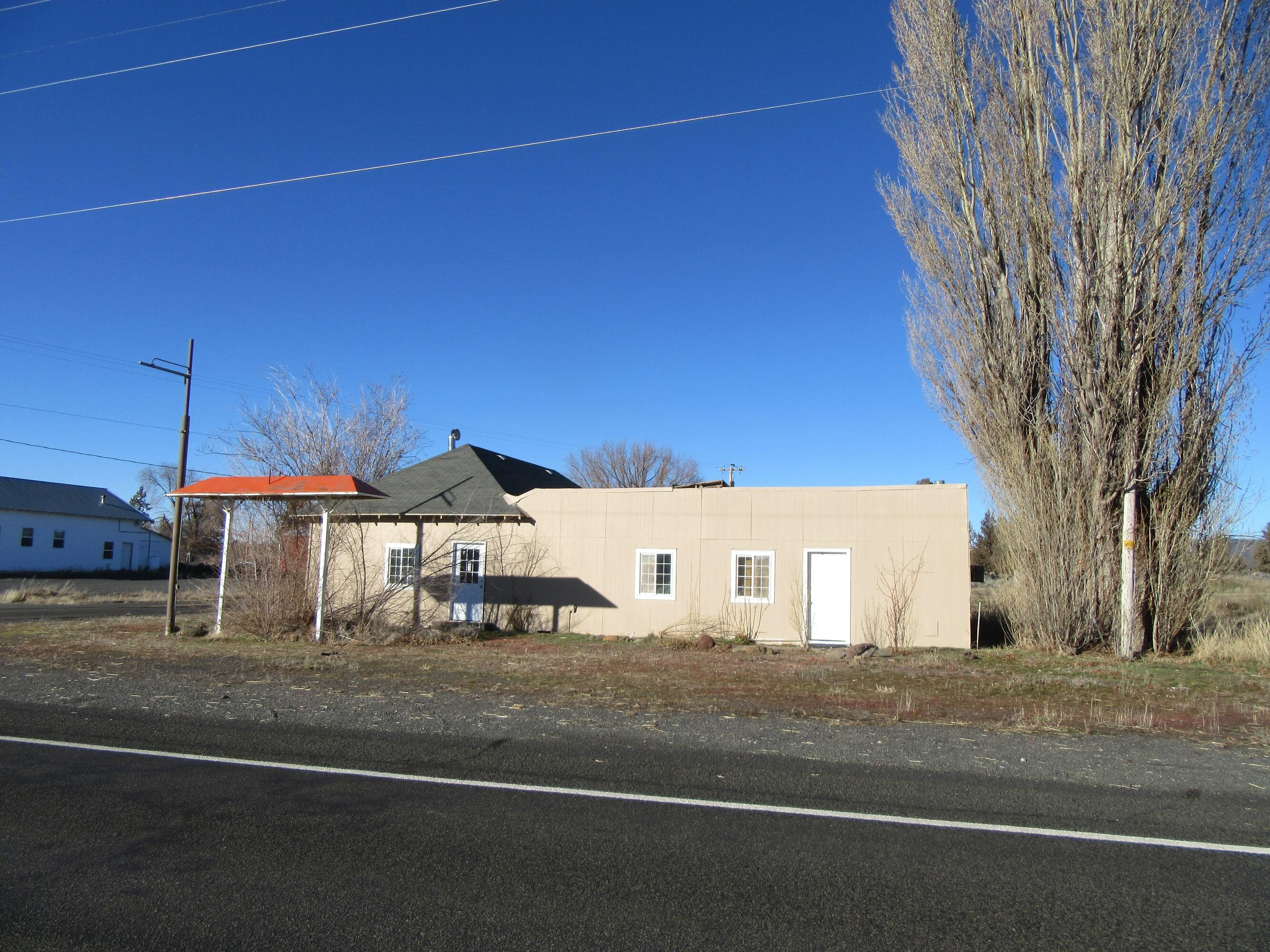 Zoned Commercial transportation on nearly 3/4th of an acre this home is stated to have approximately 3100 sq ft according to county assessor. It has had a store, a bar and post office in it's history. Seller says it is county approved to have 8-10 RV or trailer hookups on it. It will need engineered approved plans  with county for that to go through. Interior of building feels solid, but quirky and needs a lot of work. There are also 2 small out bldgs that are a part of property.