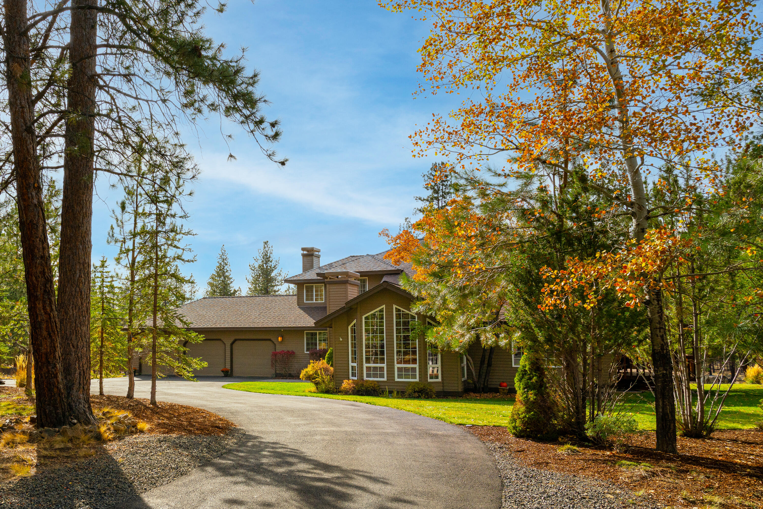 Looking for elbow room and some peace and quiet? This lovely home in Woodside Ranch is on 2.29 acres and tucked away at the end of a quiet cul-de-sac on the edge of the Deschutes National Forest.  You'll love watching the deer in the expansive park-like backyard while sitting by the fire in the cozy family room.  The kitchen and eating area open to the family room and there is a spacious deck and large fire pit area out back that are perfect for entertaining. Separate living and dining areas have nice flow with vaulted ceilings, large windows.  A dedicated office with build-in bookcase and one bedroom are downstairs. Laundry room and three bedrooms are up including a private covered deck off the primary suite. All bathrooms have been beautifully updated. This property offers a 2 -stall 1358 sq ft barn with tack room, water, and power plus extra storage. There are 2 fenced dry lots and miles of trails out your back door. Three car garage and room to park your RV.