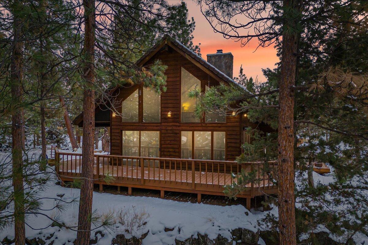 Live in the heart of in-demand Rimrock West in NW Bend, bordered on 3 sides by the Deschutes River, 5 river-access points exclusively for neighborhood owners, with access to the River Trail & minutes to downtown. In a lovely, wooded setting, you'll find a well maintained home w/hardwood floors, floor to ceiling windows & vaulted ceilings in the Great Room & Dining Room, gas fireplace in the Great Room, and nicely appointed kitchen w/Pantry.  A Primary Suite & Guest Bedroom are on the main level along with a generous laundry & mud room.  The loft area has been used as the 2nd Guest Bedroom or could be Office, Exercise or Family Rm. The attached over-sized two car garage has a large dedicated shop or could be an office or exercise room if a shop isn't your thing. There's also a large attic storage room.  Outside, enjoy the generous deck and a hot tub perfect for entertaining or a quiet private soak.  All on a quiet .61 acre elevated home-site where you will feel above it all.