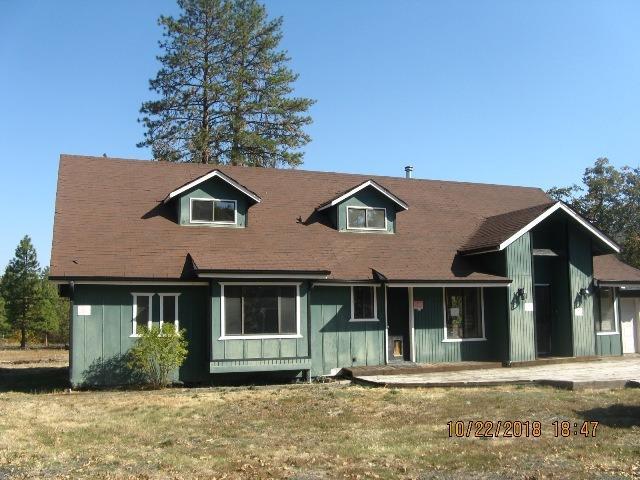 Great rural Eagle Point location on end of quiet culdesac for additional privacy. Nice 2 story home with master bdrm downstairs, large kitchen and open living/dining area, loft style bedroom upstairs, attached 1 car garage and detached 2 car garage with living space (check for permitted usage). Back and front decks for easy living. Note property is known to have asbestos on the land - seller will not be removing or performing any further work on home/property.