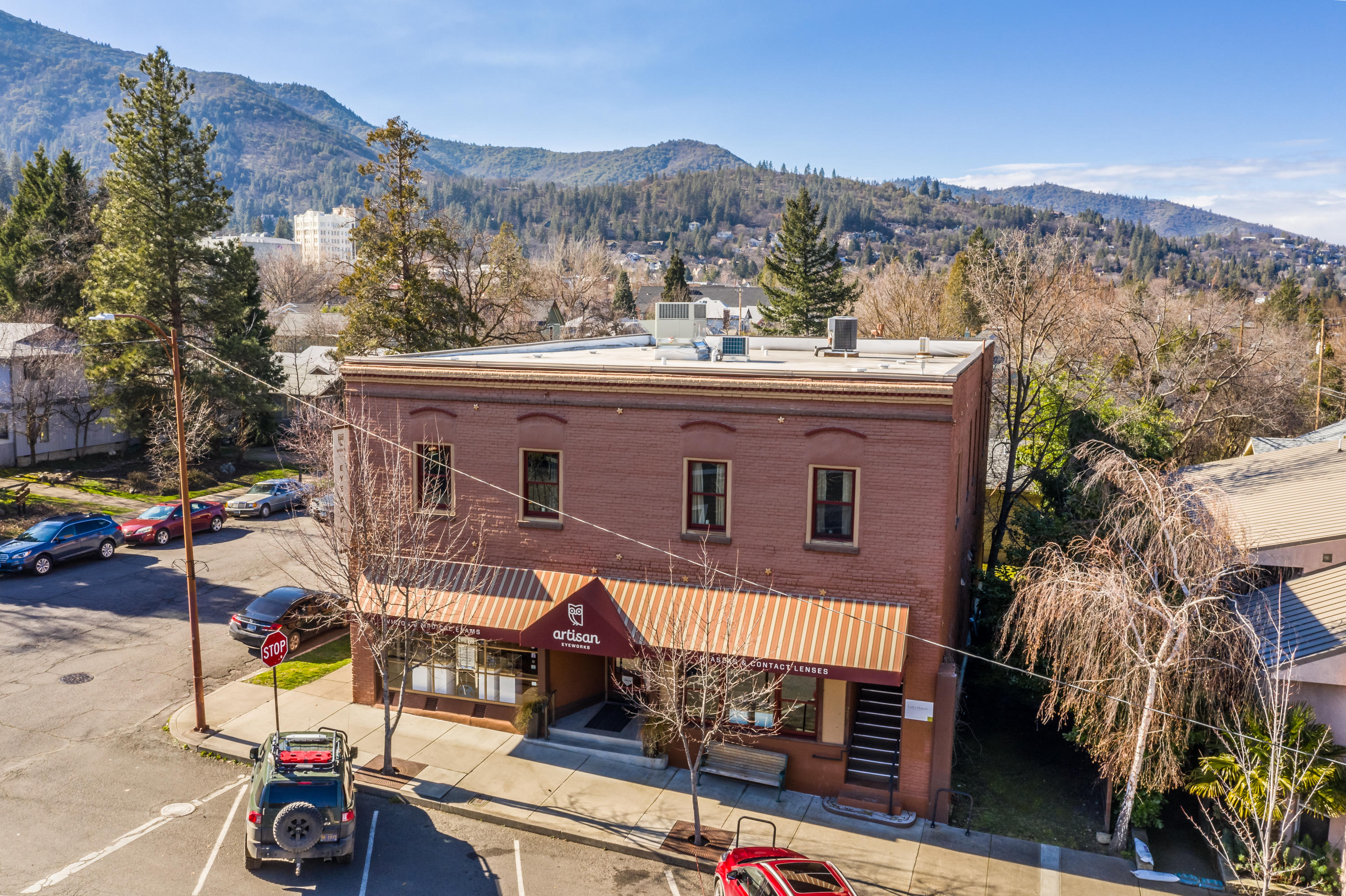 Wonderful location in the heart of the vibrant Railroad District for this stunningly attractive commercial offering. Originally built in 1900 this property was lovingly and expertly renovated in 2008 with additional upgrades throughout the years. Beautiful condition for these six individual spaces, 4 commercial & 2 residential. Ground level upscale professional optometry & retail business, architect office, a boutique furniture gallery, large former dance/yoga studio with rich mahogany flooring & two residential studio units. Finishes include newer paint throughout, some heating & air systems, indoor fire suppression sprinkler system, custom Loewen windows & casings, Travertine tile & rubber roofing. All information is deemed reliable but buyer to perform all due diligence to verify.