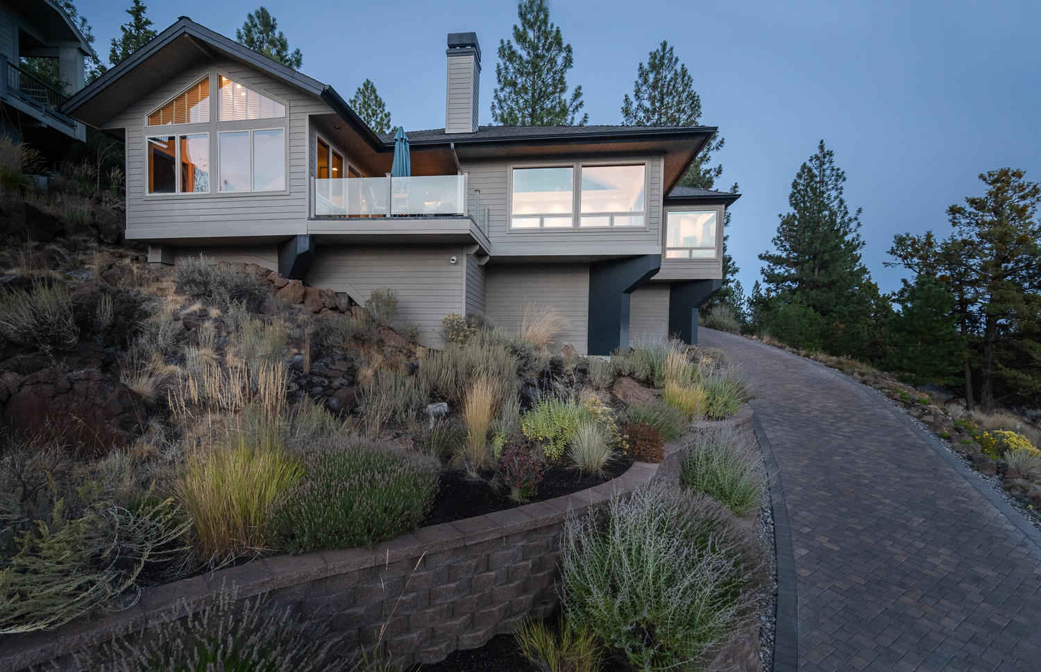 Perched high on Awbrey Butte, this primarily single level home provides stunning views of the Cascade Mountains from almost every room! Light and bright with vaulted ceilings and ample windows. Gourmet kitchen features granite counters, custom cabinets, huge walk-in pantry, Dacor and Subzero appliances, prep sink and built in wine cabinet. Entertainer's delight with its open floor plan and exterior decks/patios. Master suite provides views of Mt. Bachelor, gas fireplace, large tiled shower and jetted tub. The 780 sq ft upstairs addition features open beamed vaulted ceilings, built in cabinets and storage benches, hardwood floors, a full bath and cedar closet. Perfect for a home office or guest suite! Improvements in 2019 include a heated paver driveway and epoxy garage flooring. The exterior accessed basement provides a ton of extra storage and is easily accessible off the driveway. Double lot provides privacy and/or potential to build an ADU. Spectacular home!