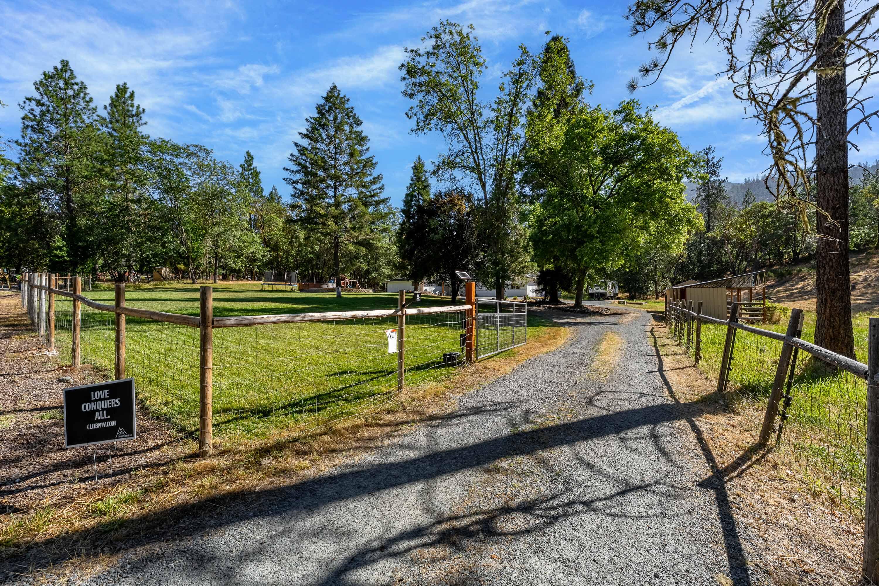 Welcome to the perfect blend of modern comfort and country living! This beautifully remodeled home sits on over 2.5 acres, offering plenty of privacy while only a few minutes from town. Step inside to discover a thoughtfully updated interior featuring fresh finishes, new flooring, modern fixtures, and a bright, open floorpan. A tasteful remodel in 2024 added 480 SQFT of living space, including an office, bedroom, storage, and second living room. The remodel incorporated a new HVAC system, upgraded to accommodate the extra square footage. Additionally, the pellet stove and heated tile floors in both bathrooms will keep you cozy in the winter. Outside, the possibilities are endless! Whether you envision a hobby farm, garden, workshop, or room for animals, this property delivers! There's an RV pad with power and water, a chicken enclosure, a 10x20 shed built in 2024, and a good well and in-ground sprinkler system to take care of your irrigation needs. Schedule your appointment today!