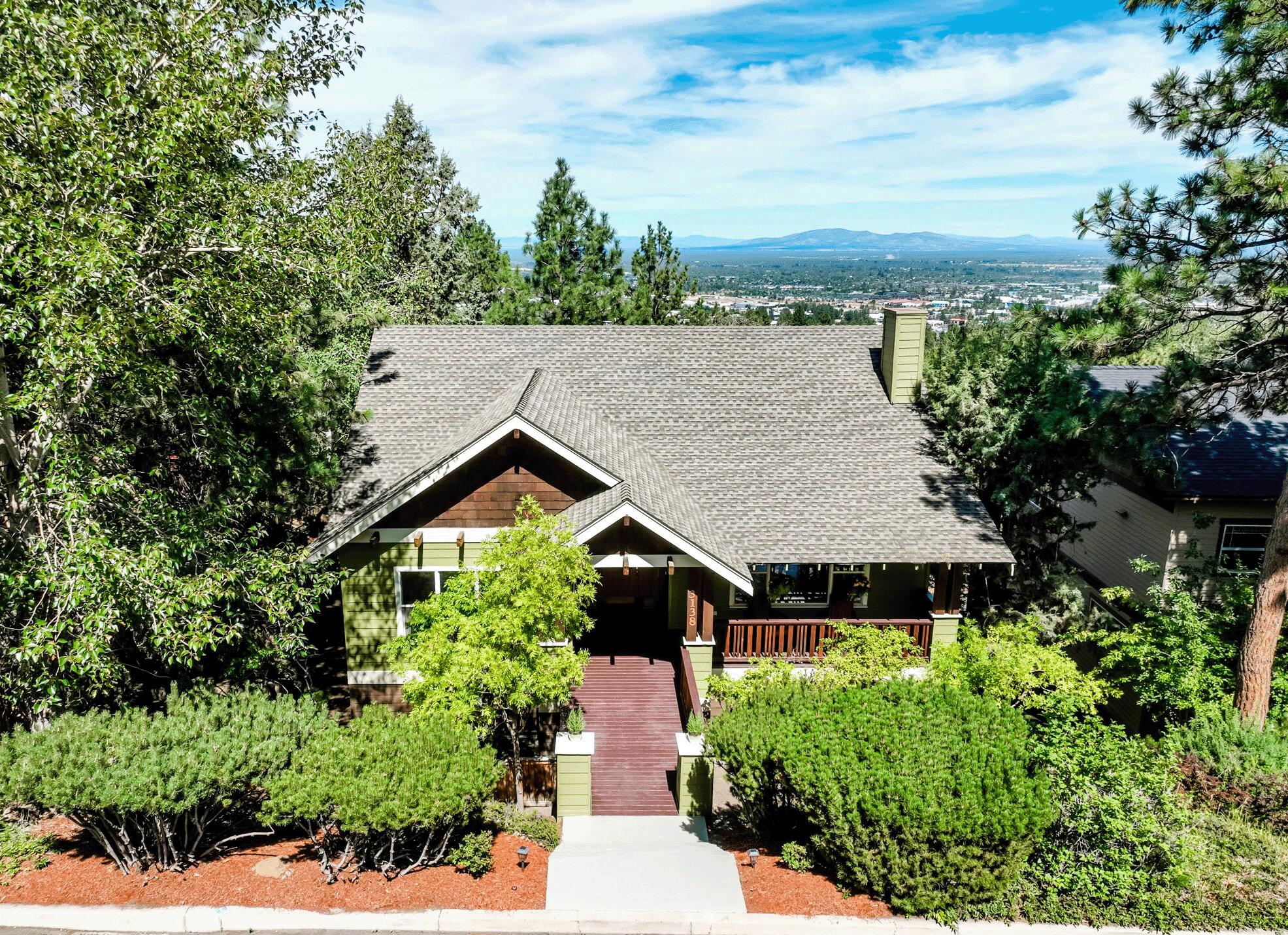 **Motivated Seller** Lovely Awbrey Butte home with city views and a functional layout! Main-level living includes a spacious primary suite with deck access and a flexible 4th bedroom or office. Open living, dining, and kitchen areas feature high ceilings, large windows, and a warm fireplace. A multi-level deck extends your living space outdoors. Downstairs offers two additional bedrooms, a generous family room, storage, and access to a lower deck & low maintenance side yard. Enjoy the comfort of forced air heat and A/C, a large 2-car garage, and a covered front porch your own cozy retreat. Located on Bend's westside with easy access to parks, trails, shops, and so much of what Bend has to offer. A beautiful, well-maintained home ready for its next chapter!