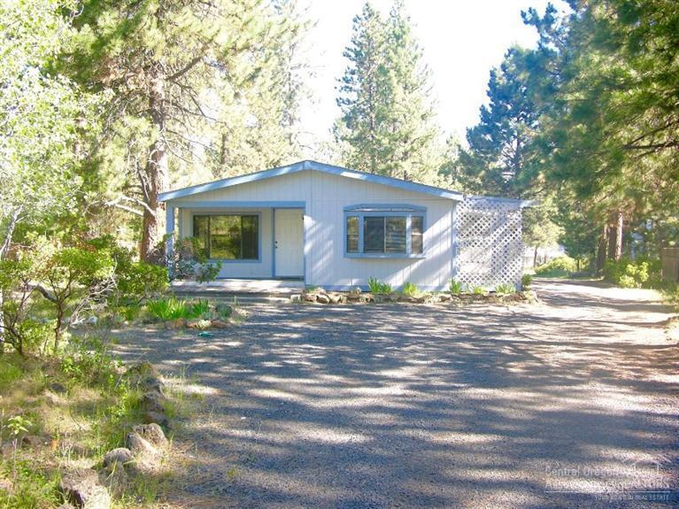 Comfortable home on almost an acre in a neighborhood of more expensive stick built homes. Privately set back from the road and close to the Deschutes River and surrounded by big mature Ponderosas. Awesome 24'x34' shop building.