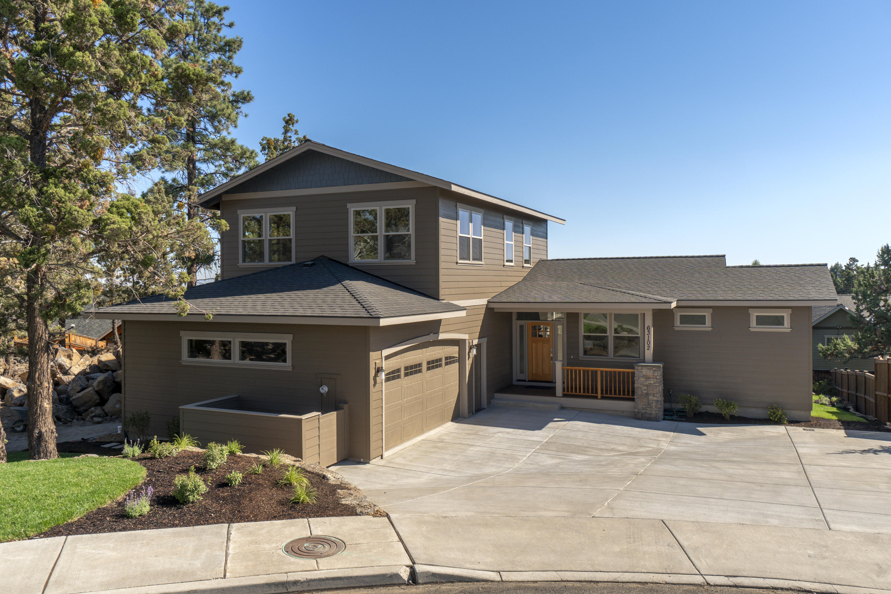 Beautiful new construction in desirable Yardley Estates neighborhood in NE Bend. Located in a quiet cul-de-sac, this well-built custom floor plan offers light and bright great room, spacious kitchen, powder room, laundry room, office and main level master suite. Upstairs includes spacious bonus/family room, two bedrooms and a full bathroom. Great room features vaulted ceilings, hardwood floors and gas fireplace with built-ins. Open kitchen boasts quartz counters, Knotty Alder cabinets, large island with pendant lighting and breakfast bar, walk-in pantry and stainless-steel KitchenAid appliances. Spacious master suite features nicely finished en suite with large walk-in tile shower, dual sink vanity and walk-in closet. Covered rear deck leads out to the large landscaped and fenced backyard. House is solar ready. All this, just minutes to schools, restaurants, Cascade Village shopping center, grocery stores and easy access to the parkway heading North or South.