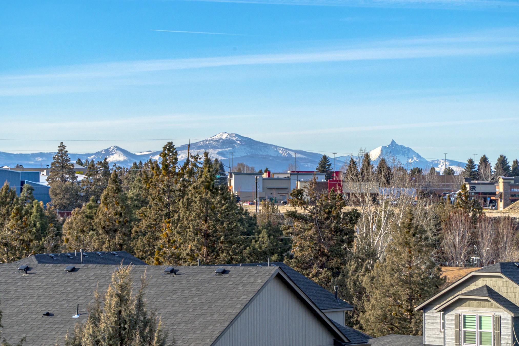 Another Southcrest beauty perched on a rock outcropping allowing for great territorial and Cascade Mountain views from almost every room in the house.
This 1716 sq ft, 3 bedroom, 3 bath home has an easy living feel. The great room is where you'll most likely be spending most of your time. Windows abound with a granite slab kitchen which opens to the living area featuring a corner fireplace, and those Cascade Mountain views! Generous sized bedrooms and a fabulous main suite with walk-in closet upstairs for added privacy. Just a couple minutes from the Parkway, allowing easy access to all that Bend and the surrounding area has to offer.