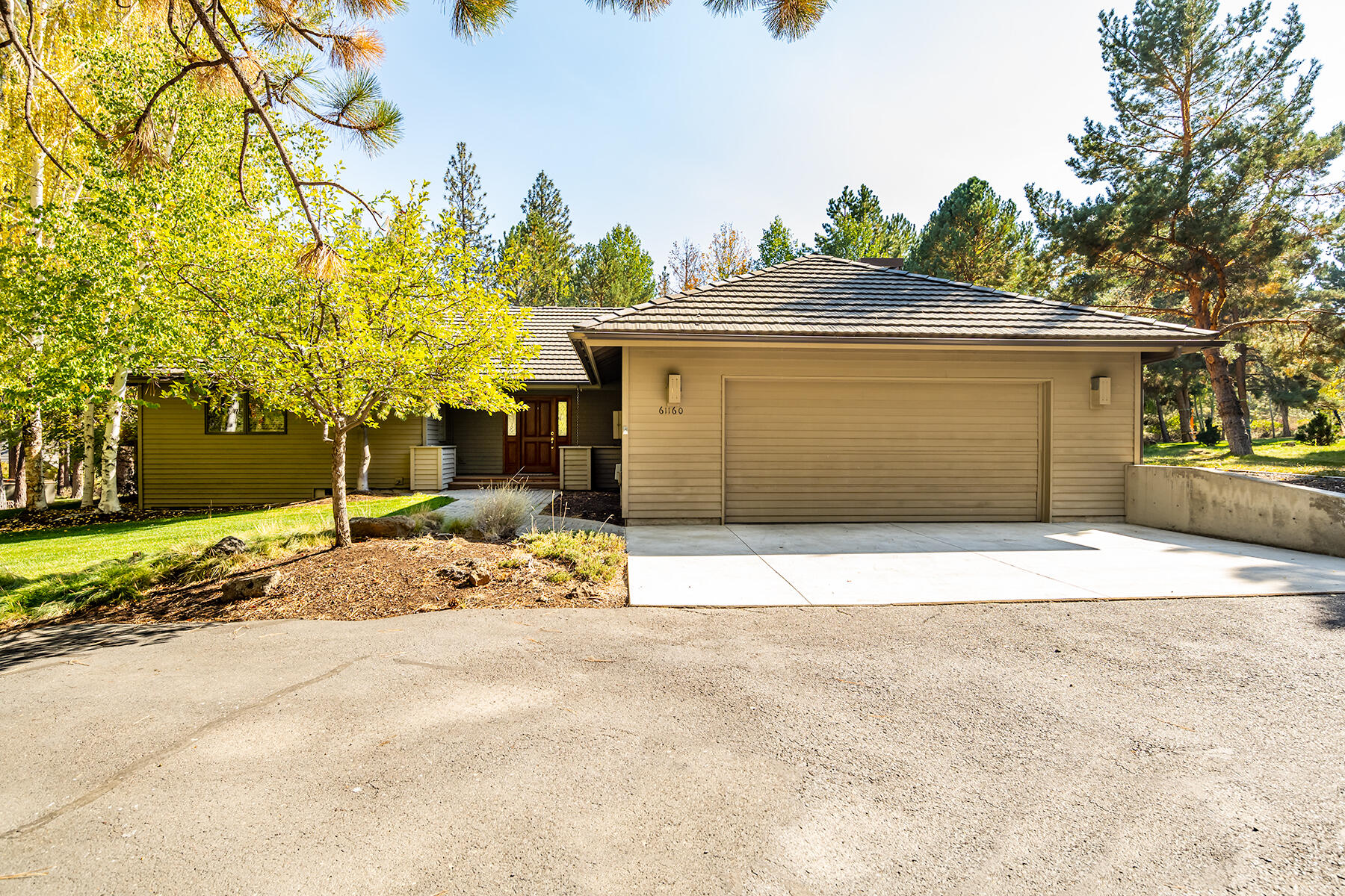 Sunrise Village, a very family friendly subdivision  It is nestled between the Deschutes River and scenic Century  Drive.  The home is single level home is a secluded neighborhood of large lots with beautiful aspen, pine trees, manzanita &  manicured lawns. The many paved trails give  one access to the club house, tennis 
courts  & pool, One of the most private settings in Sunrise Village. The primary rooms are in the back part of the home opening onto massive deck area and a view of the landscaping with an abundance of trees shielding from other homes.  The primary bedroom is impressive with access to the back deck and nicely configured bath and very large closet.