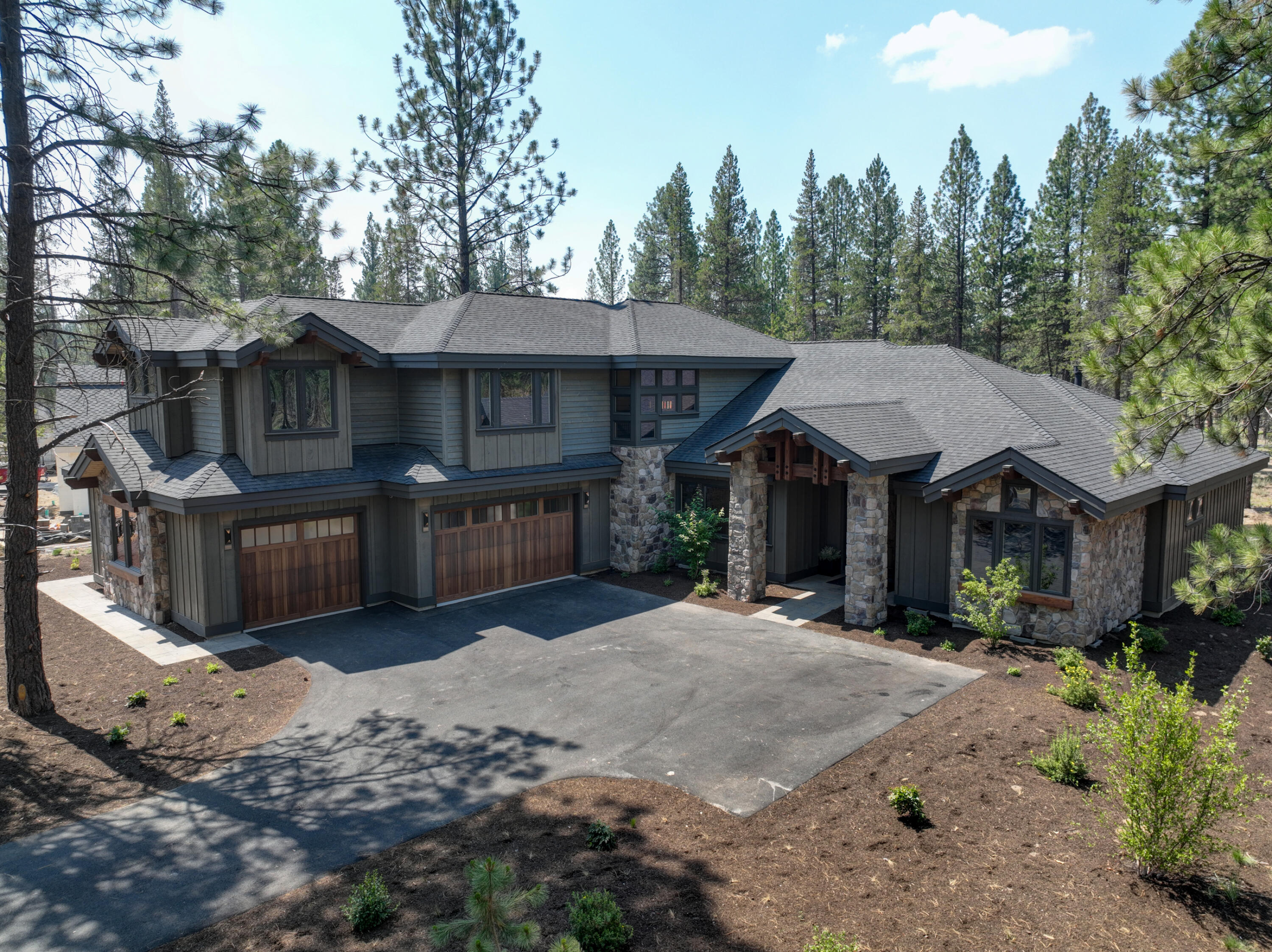 Open House 12/29 from 12-2pm! Stunning, completely furnished, brand new custom NW mountain style home in highly sought after Caldera Springs. 4344 SF, custom knotty alder cabinets, extensive stone, designer lighting, 2 refrigerators,2 sets of washers/dryers, and much more. Great room plan with fireplace, gourmet kitchen, walls of windows, high ceilings. Features include a main level primary suite with gas fireplace,4 additional ensuites with private baths,main level den, 6th finished flex room. Space for all of your Central Oregon gear in the 3 car garage. Enjoy summer evenings on the covered paver patio backing to extensive common area. Owner amenities include a 9-hole golf course, tennis, pickle ball, parks, paddle boarding, kayaks, pool, fitness, miles of walking & bike paths, lakes & water features. The brand new amenity center, Forest House, scheduled to open Summer 2024. Great proximity to Sunriver, Bend, rivers, mountains,skiing.
