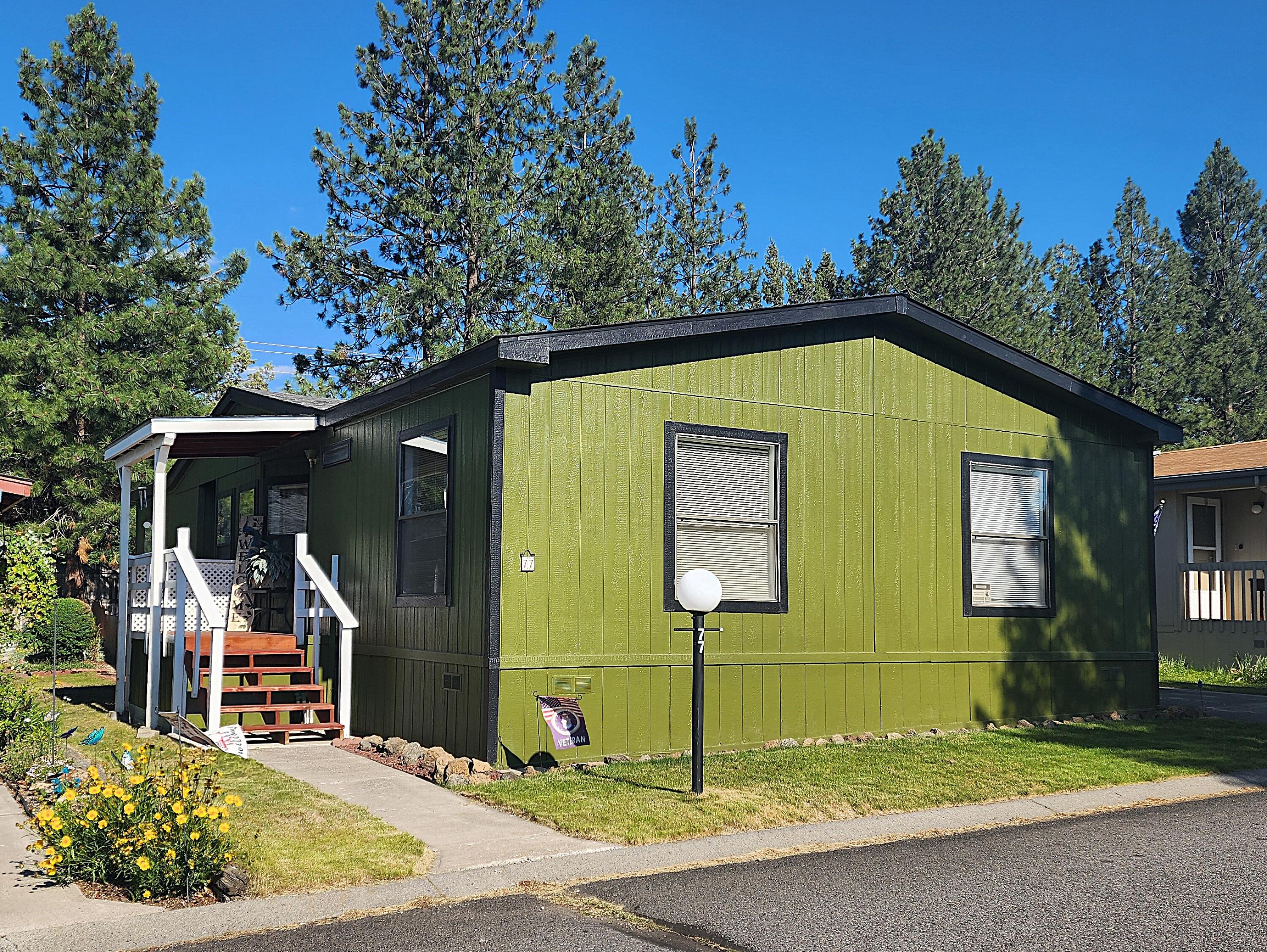 Terrific home in desirable 55+ Suntree Village in Bend.  Efficient floor plan, vaulted ceilings, and freshly painted exterior.  Kitchen boasts generous storage throughout and island with double sink. Dining area has built-in storage and cute display space.  Large primary suite with double vanities, lots of storage, and walk-in-shower.  Super cute, fenced backyard with deck and planter box.  Deep carport with storage shed.  Close to Larkspur Community Center.  Space rent is $599/month and includes water, sewer, garbage, debris pick-up, clubhouse, and street snow removal.  Come check out this amazing home!