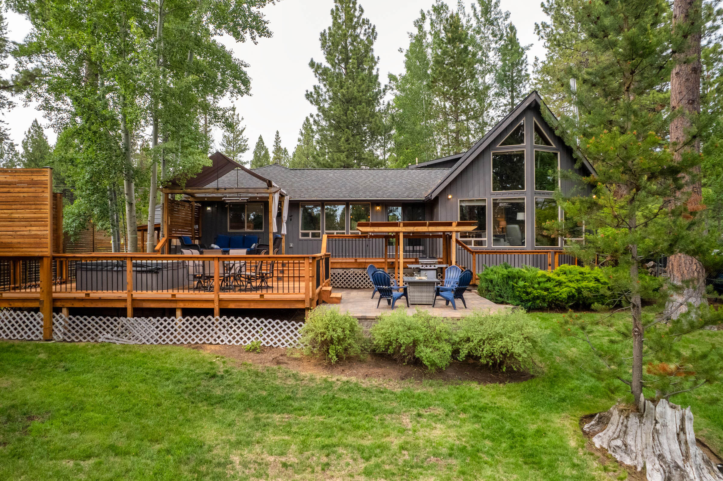 Welcome to your dream waterfront escape! Nestled among whispering Aspens and towering Ponderosa Pines, this 4-bed, 3-bath beauty is the perfect blend of luxury and nature. Lounge on your multi-level deck, soak in the private hot tub, or launch straight from your own dock for sunset cruises or epic fly-fishing. With two spacious primary suites - one on the main floor and one on the second floor, along with a  bright open layout, and seamless indoor-outdoor flow, entertaining is effortless. The neighborhood offers a private marina, scenic trails, and year-round access to the river—only 30 minutes to Mt. Bachelor and  9 minutes to Sunriver Village,  5 golf courses, breweries, shopping, and more. Don't wait any longer for the dream to become reality. Rare, radiant, and ready for you!