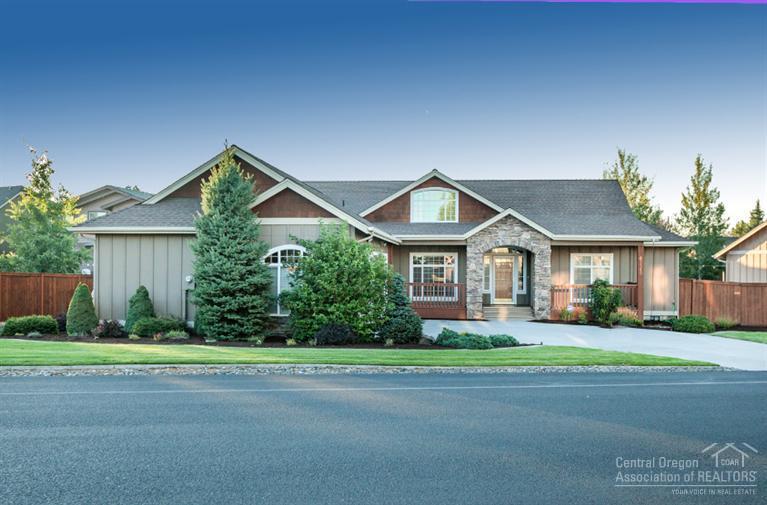 Beautiful custom home in the SE Bend Ridgewater development. Great room floor plan w/soaring vaults, Hickory floors, Slate entry, Gas FP. Open Kitchen w/multi level cabinets, SS appliances, built in wine rack, bar sink, tons of storage. 3 br+ office/4th br, Master separation, Soaker Tub, Tiled Shower, huge closet. Wood blinds, Crown Mldg, quality craftsmanship! Triple garage w/cabinets, RV parking, pristine landscape, Sunsetter awning & paver patio. MUST SEE!