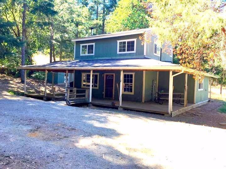 Story book cottage on over 5 almost all level treed acres. Some meadows and pastures, good well, Large horse barn with stalls, and a shop. Access down a long private driveway. With some fencing would make nice horse set up or family farm.great country kitchen and hardwood floors with complete wrap around porch.This is what you are looking for. Perfect for farming, great horse set up and potential for a grow site.
