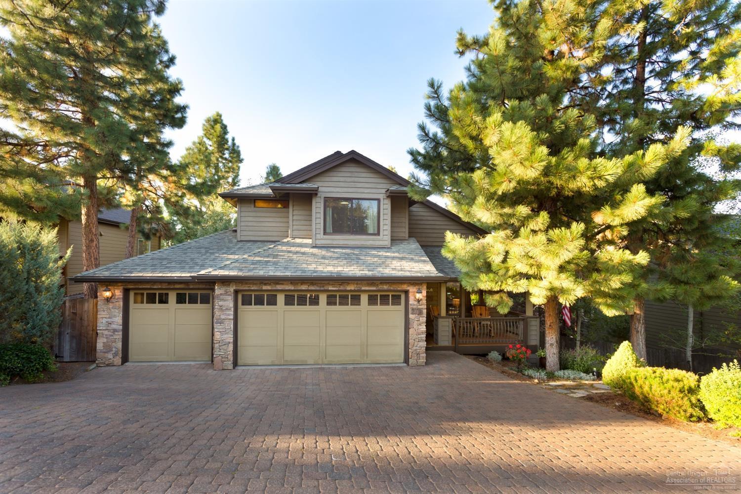 Gorgeous fully landscaped home with private drive with no HOA's. Feeling of complete privacy on this large maintained lot close to all Westside Amenities. This 4 bedroom, 3.5 bath home comes with a day basement. 3 car garage, additional storage space and 2 hot water heaters. Indoor/Outdoor entertainment on freshly stained deck. Wood doors/trim, cherry hardwood flooring, stainless appliances, cedar siding. Wonderful family neighborhood. Kids, NWX Lake, Shevlin park and trails for biking and running.