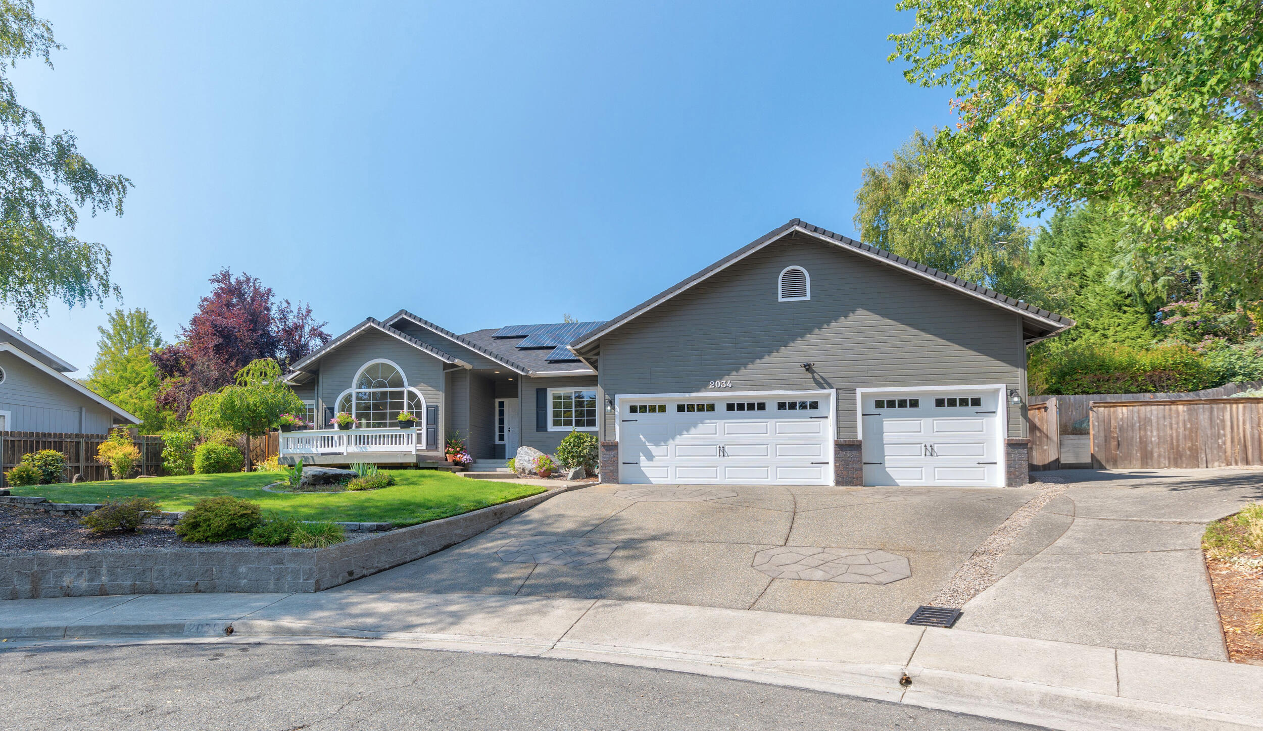 Gorgeous Sigle Level Home Located In Desirable NW Grants Pass Neighborhood Featuring Beautiful Heated In-Ground Pool! This 2,074 Sqft Home Has Been Lovingly Cared For With Many Recent Updates In 2022 Such As Natural Hardwood Floors Throughout, Hallway Bathroom Remodel, Complete Interior Painting, Updated Flooring In Laundry Room, Over 50K Spent On Solar System, French Doors Open Out To Expansive Concrete Covered Patio Area, Custom Wine Bar W/Beautiful Granite Counter Top & Allavino 3 Zone Wine Cooler Holding Up To 56 Bottles! Bulit In Shelving System In Living Room. 3 Bedroom, 2 Full Baths, & Office. Kitchen Has Double Oven & Gas Cooktop Granite Counters, W/Subway Tile Backsplash, Breakfast Bar, Natural Light Throughout W'Skylights & Lots Of Windows!  Ample Sized Master Suite W/Slider To Patio, Large Walkin Closet Leads To Nice Mud Room W/Utility Sink. Master Bath Showcases Large Soaking Tub & Custom Tiled Shower! Large 3 Car Garage & Side Parking! Entertainers Delight!