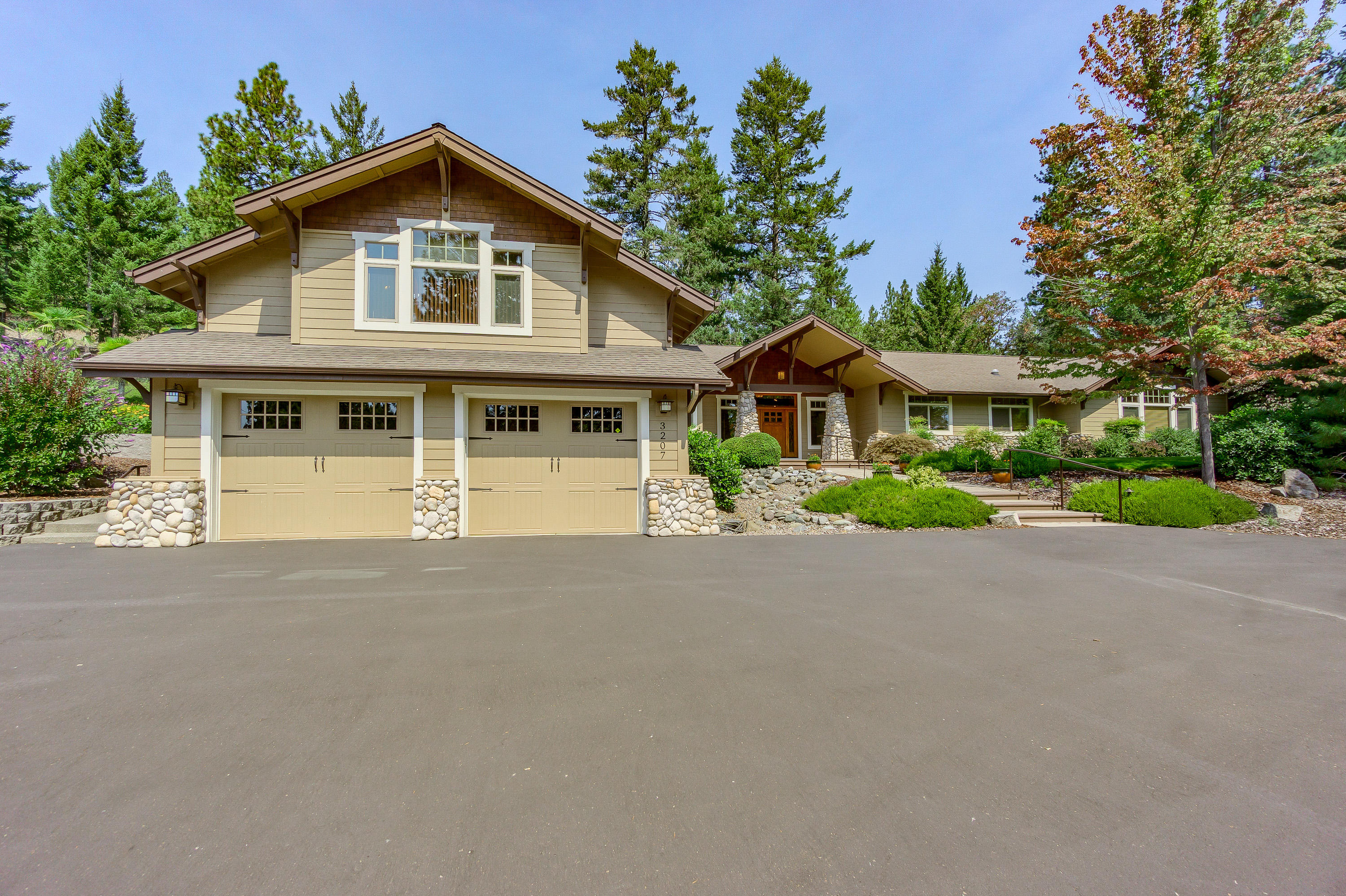 Rare find on Old Military Rd on 6.11 acres. Level & rolling w/beautiful Evergreens & mature landscaping w/night lighting. Craftsman detail w/Korbels & open beam ceilings, river rock columns, paved circle electric gated entry. Grand entry door w/stamped stained cement. 4 bdrm, 4 baths, 3996 SQFT Home is fully updated & remodeled. Hardwood hand scraped pecan floors w/slate inlays. Living rm w/river rock floor to ceiling wood burning fireplace, lg built in bookcases, French doors to back yard. Kitchen w/custom cabinets, dbl ovens, 6 burner cook top w/ griddle, granite counters w/tile backsplash, prep sink /w island & walk in pantry. Family rm w/boxed beam ceilings, breakfast rm w/ door to covered patio, gunite pool, paver patios, raised garden beds & climate controlled green house. 2 master suites, 1 w/fireplace, French doors, sitting area, dbl sinks, soaking tub & lg tile shower. Laundry/hobby room. 40X80 Barn/Shop w/16' doors on each side + a lg 2 car Shop/finished office, RV Parking.