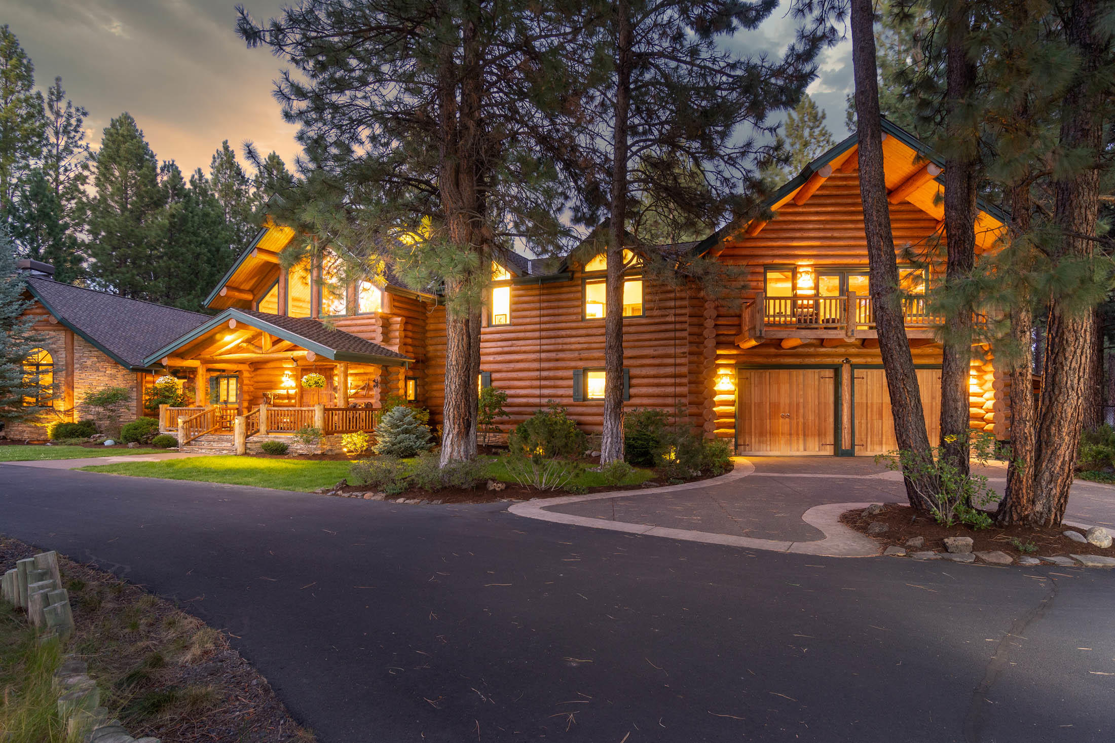 The gated entrance into this amazing equestrian Estate leads to an exquisitely designed log home with the feel of a mountain lodge. No expense was spared in the construction of this unique 6,180 sq. ft. home. It offers both cozy living and plenty of room for large family gatherings. You'll marvel at the handsome, hand-scribed Douglas Fir logs, exclusive carvings by artist Skip Armstrong, and stunning rock work, inside and out. 10+ acres of fenced, cross fenced property, 2 ponds, 5 stall barn, outdoor arena, large 3 bay shop, RV hook ups, easy access to ride out on your horses to BLM, and all backing up to beautiful wetlands. Only one mile from historic Sisters, but you'll feel like you're living in the woods!