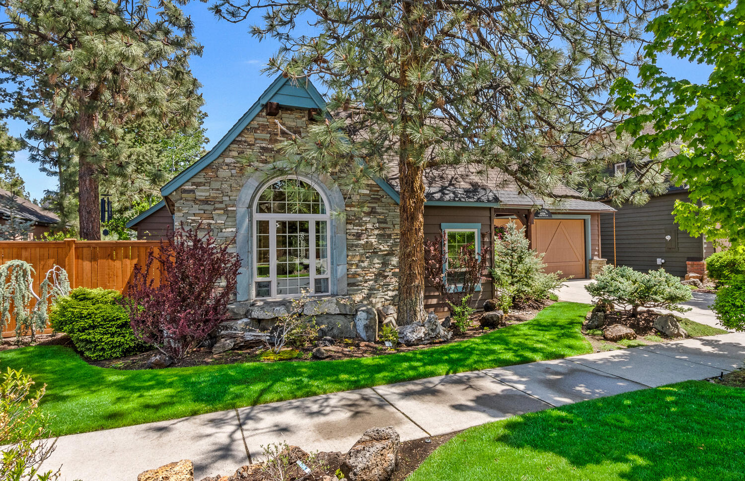 True craftsmanship shines in every detail of this Jess Alway home.  Soaring ceilings, exposed beams, and top-quality finishes compliment the open floor plan.  The main home features 3 bedrooms + an office and 2 1/2 baths.  A luxurious and separated primary suite has its own access to the back yard, spacious bathroom (with radiant heated floors), and a walk-in closet. The courtyard casita boasts its own generous bathroom, high ceilings, and the same classic finishes and flourishes as the main home. This home is truly turn-key with updated hardware and lighting, fresh paint inside and out, a new tankless water heater, custom stained glass windows, and gorgeous landscaping to enhance privacy.