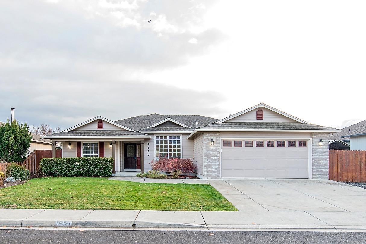 This beautiful split floor plan features 1790 sq. ft of living space with three bedrooms and two bathrooms. As you enter this home you will notice the large living room with accent ceiling lighting and a gas fireplace. The kitchen with granite counter tops opens to a dining area. There are plenty of counter space and cabinets. If you are looking for a formal dining room, we have it! The master bedroom is very large featuring a nice bathroom with walk in closet. Across the other side of the home you will find indoor laundry room as well as two other bedrooms and a bathroom. Outside you will find a well manicured lawn, covered patio and RV parking. Must tour this home.