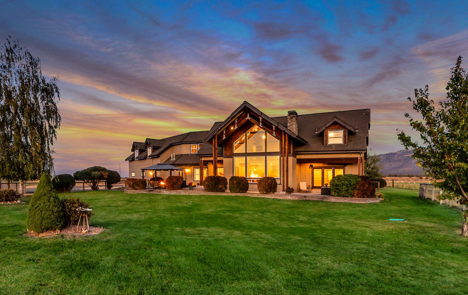 Experience unparalleled Cascade Mountain views from this 39-acre Powell Butte estate. This 4,349 sq. ft. custom home features 5 bedrooms, 4 bathrooms, a large bonus/family room, an office, and a stunning rock fireplace. Recent updates include Energy Star windows, refinished hardwood floors, new carpet, a heat pump, exterior paint, garage doors and openers. With 31.57 irrigated acres in the Central Oregon Irrigation District, this property is perfect for agriculture or equestrian pursuits. The barn includes a tack room, overhead hay storage, and covered feeding area, along with well-maintained corrals. A paved driveway ensures convenience and accessibility.